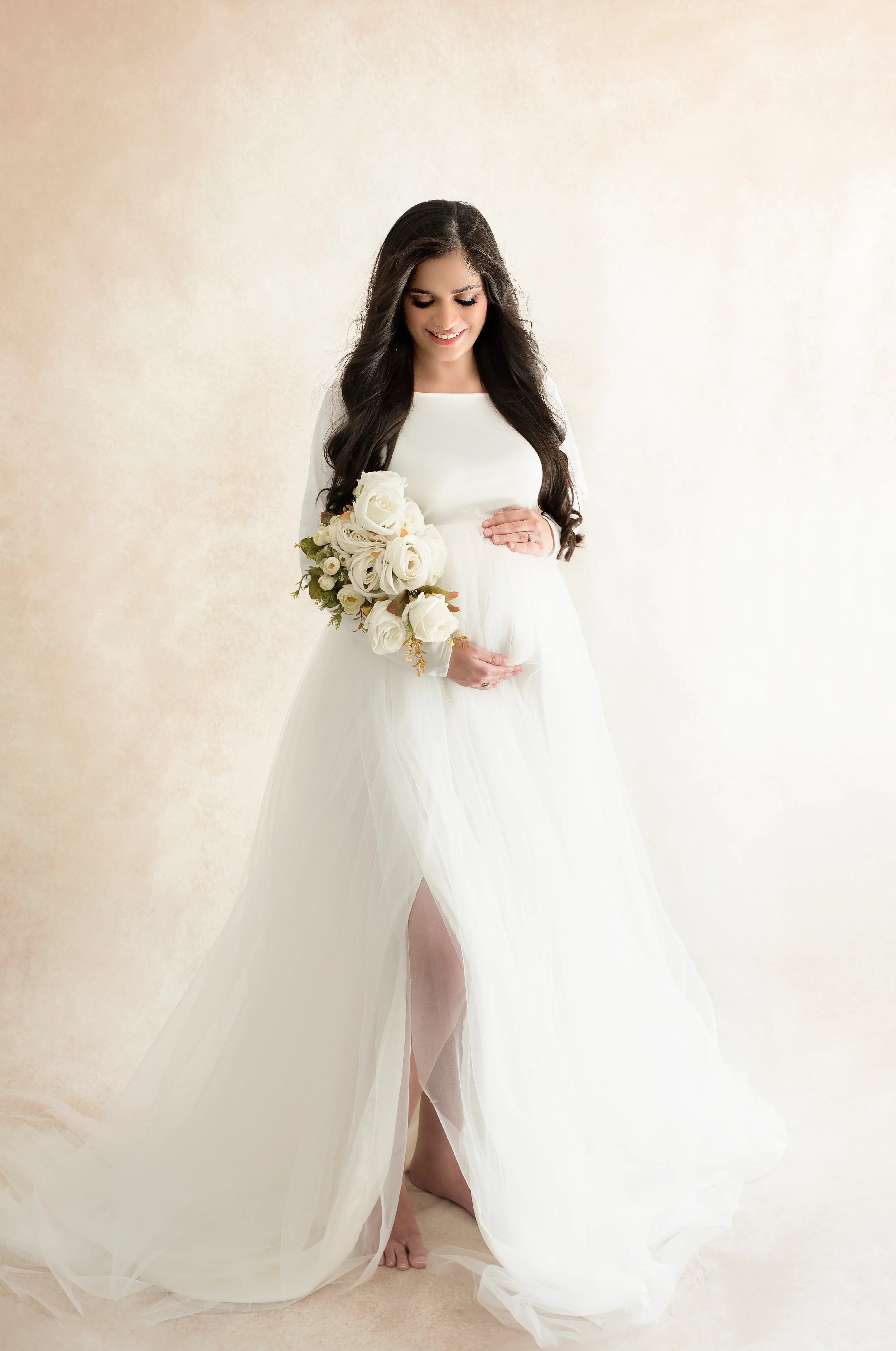 FlairNFrillz Indie White Maternity Gown with flowing fabric, perfect for expecting mothers, elegant and comfortable for special occasions.