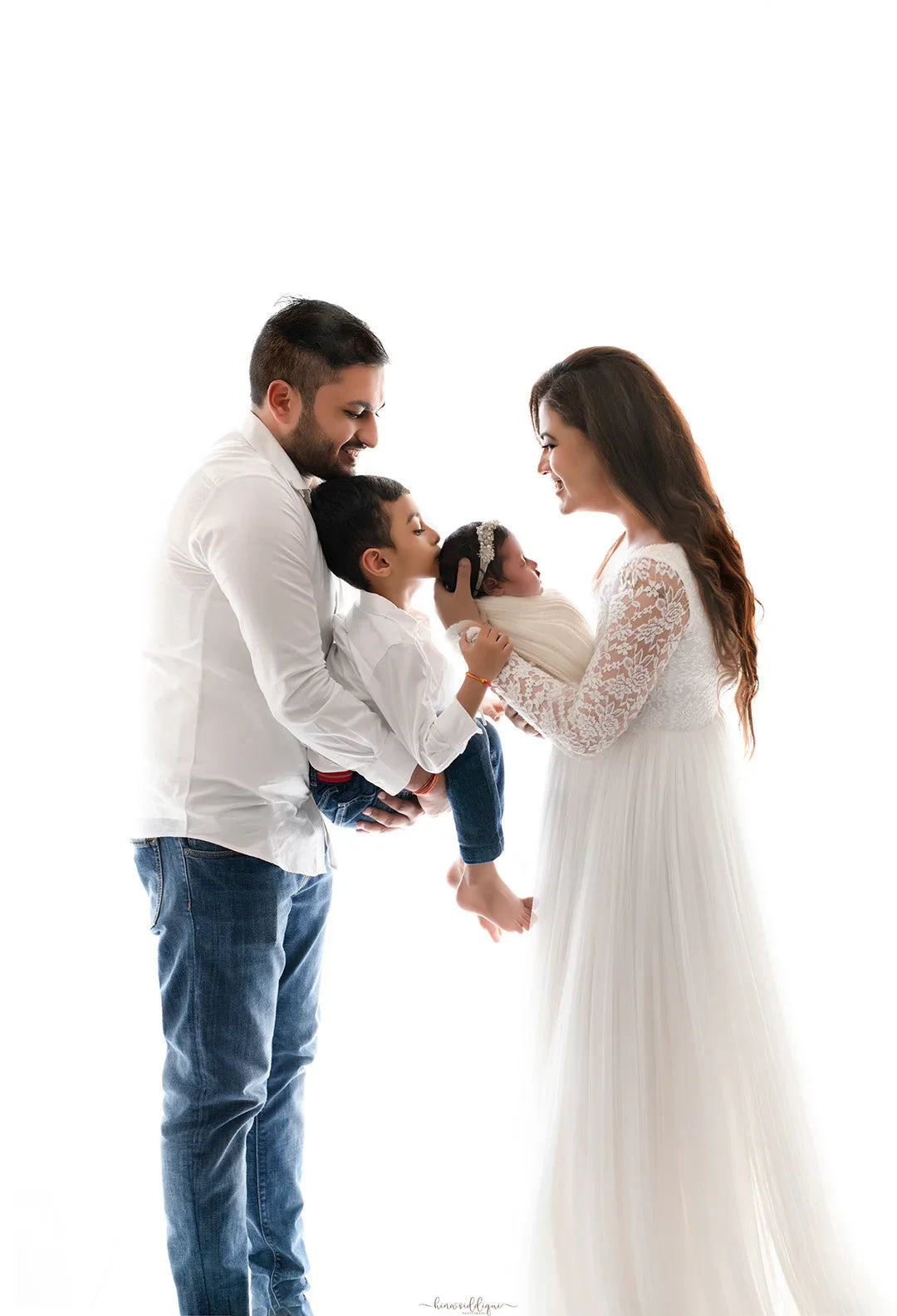 FlairNFrillz Dylan White Maternity Gown, elegant white maternity dress with flowing fabric and comfortable fit for expecting mothers.