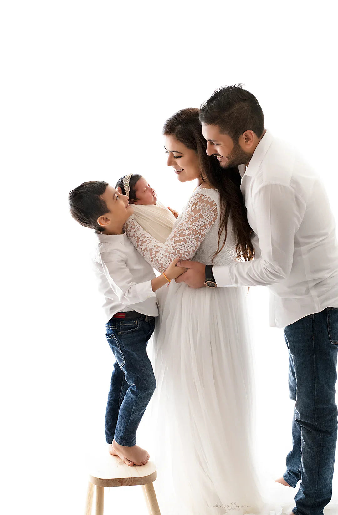 FlairNFrillz Dylan White Maternity Gown with flowing fabric and elegant design, perfect for expecting mothers.