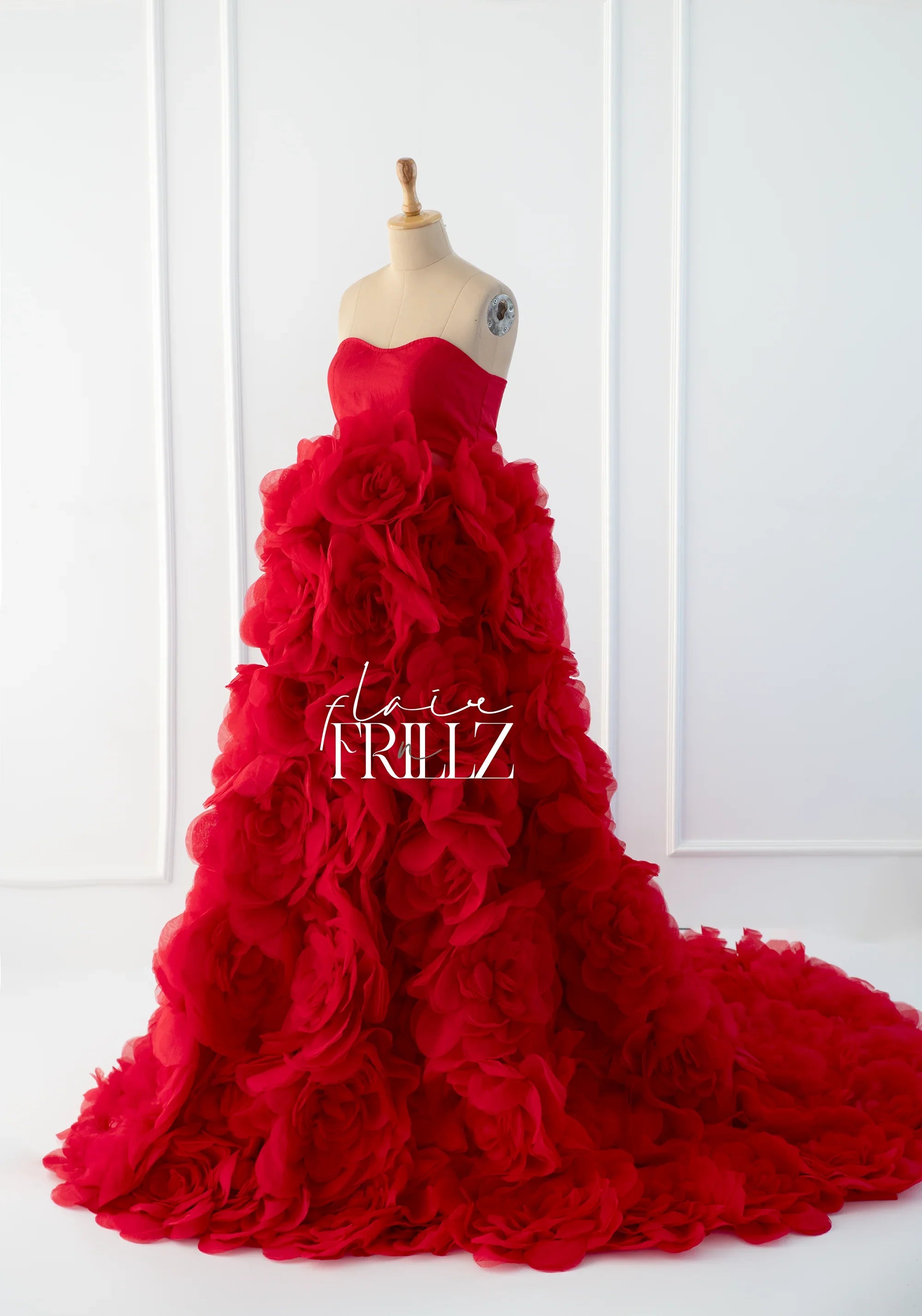 Red floral maternity gown by FlairNFrillz, featuring a flowing design and elegant maternity dress style.