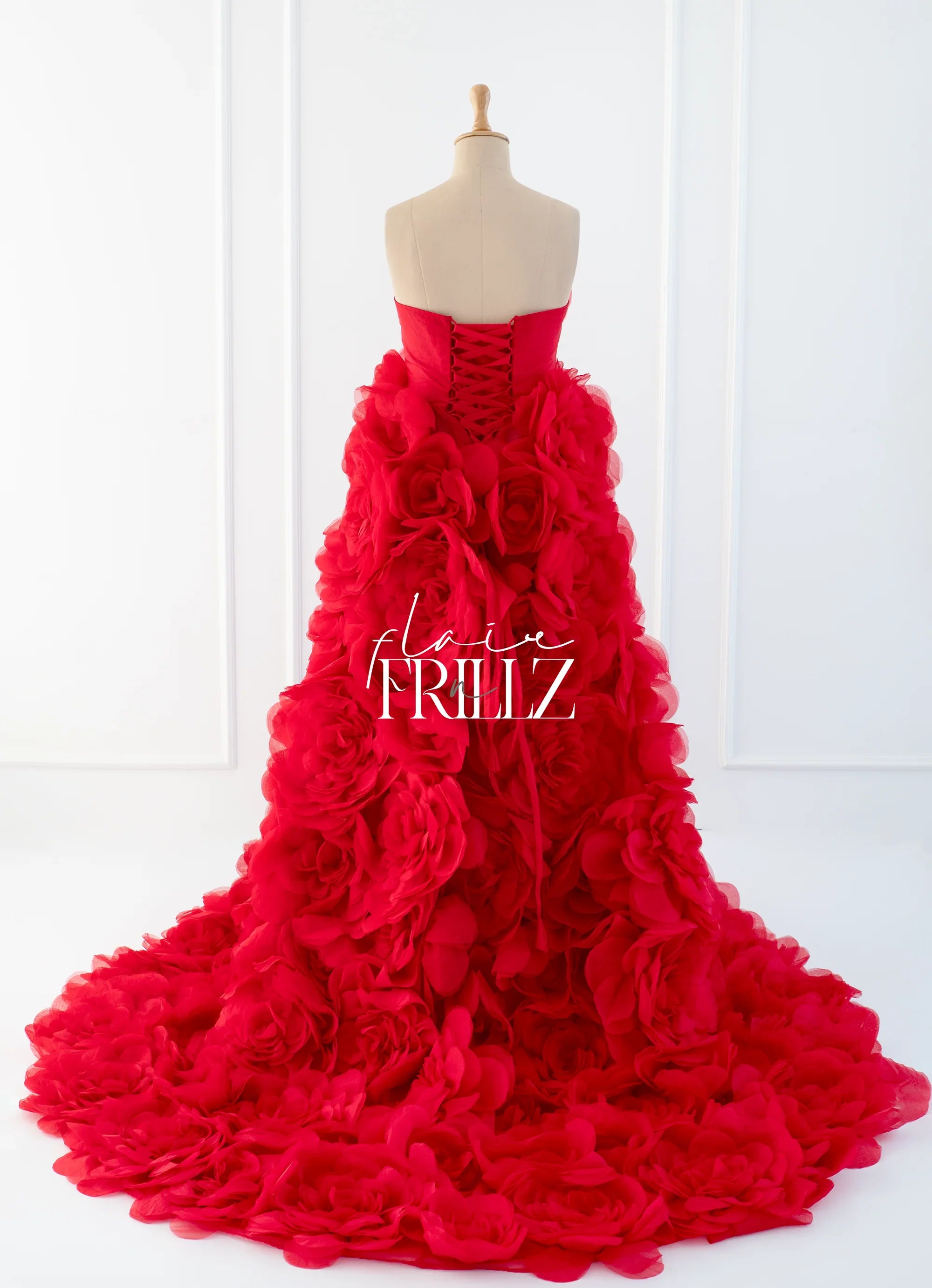 Red floral maternity gown by FlairNFrillz featuring elegant flowing fabric and a fitted waist for a comfortable, stylish look.