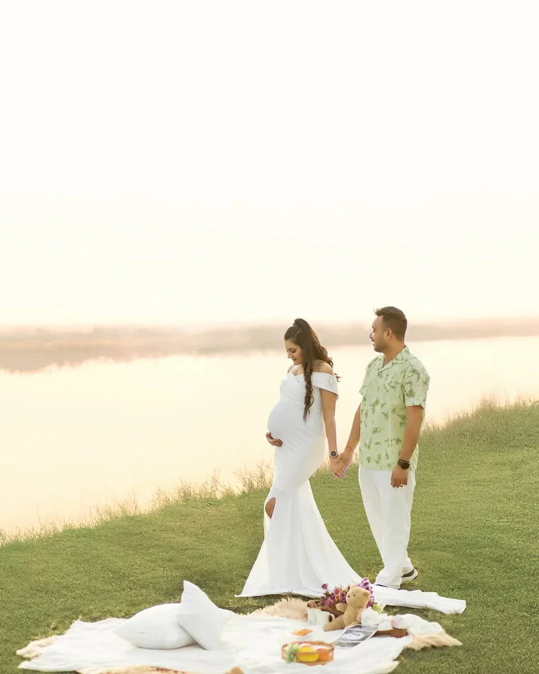 FlairNFrillz Isla White Maternity Gown with flowing fabric and elegant design, perfect for expecting mothers.