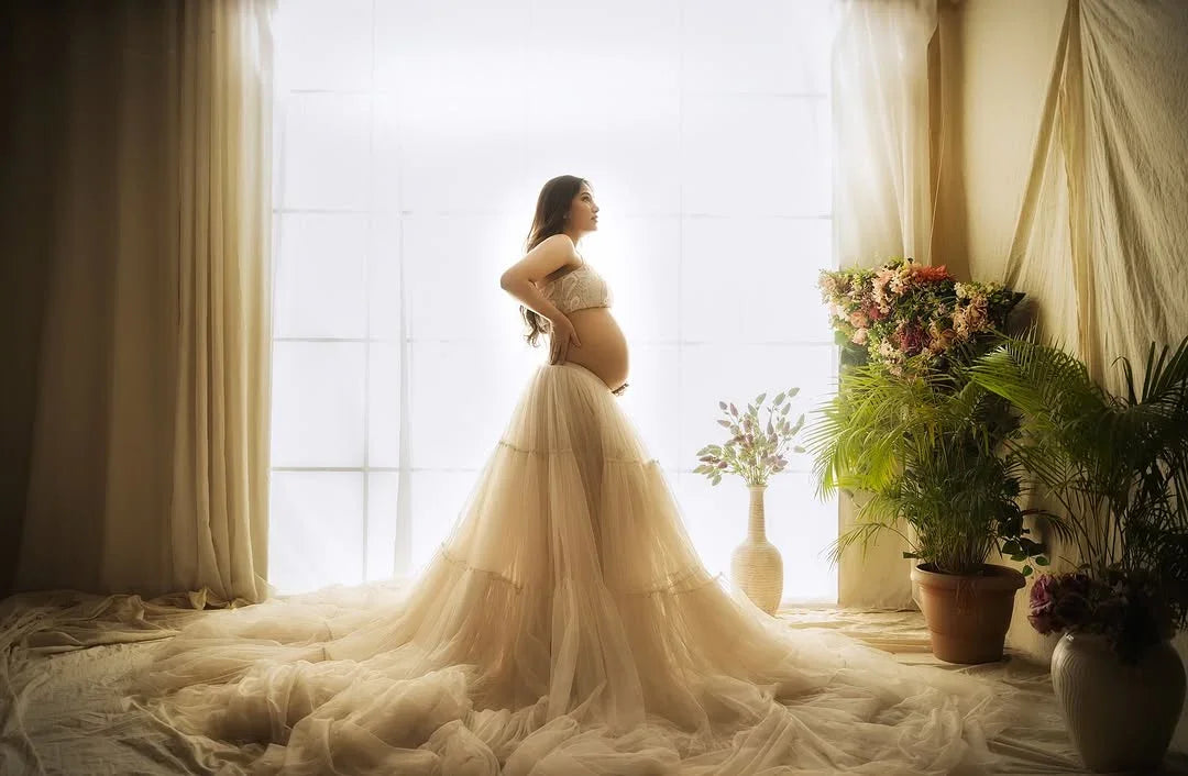 Molly Ash White Maternity Dress by FlairNFrillz featuring a flowing fabric and elegant design for expecting mothers.