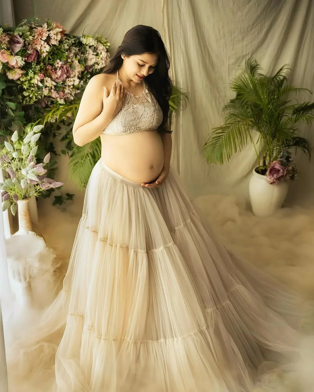Molly Ash White maternity gown by FlairNFrillz featuring flowing fabric and elegant design for expecting mothers.
