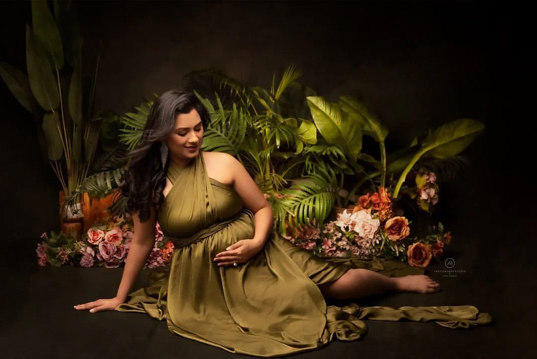 FlairNFrillz Evie Green Maternity Gown with flowing fabric and elegant design, perfect for maternity wear.