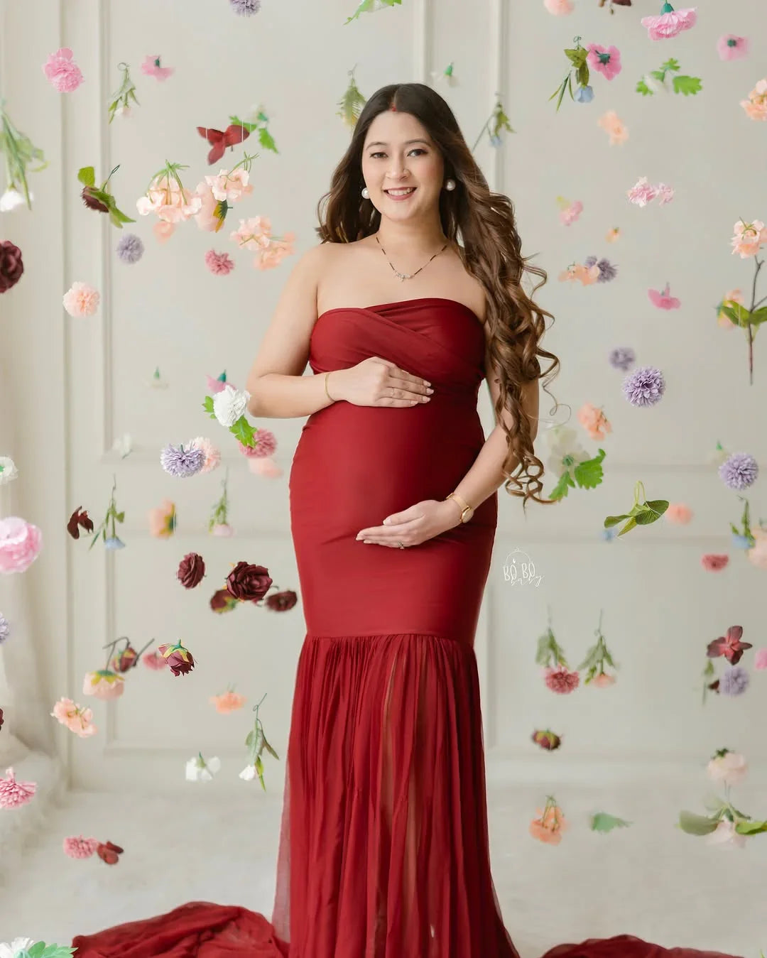 FlairNFrillz Eleanor red maternity gown with flowing fabric and elegant design, perfect for special occasions.