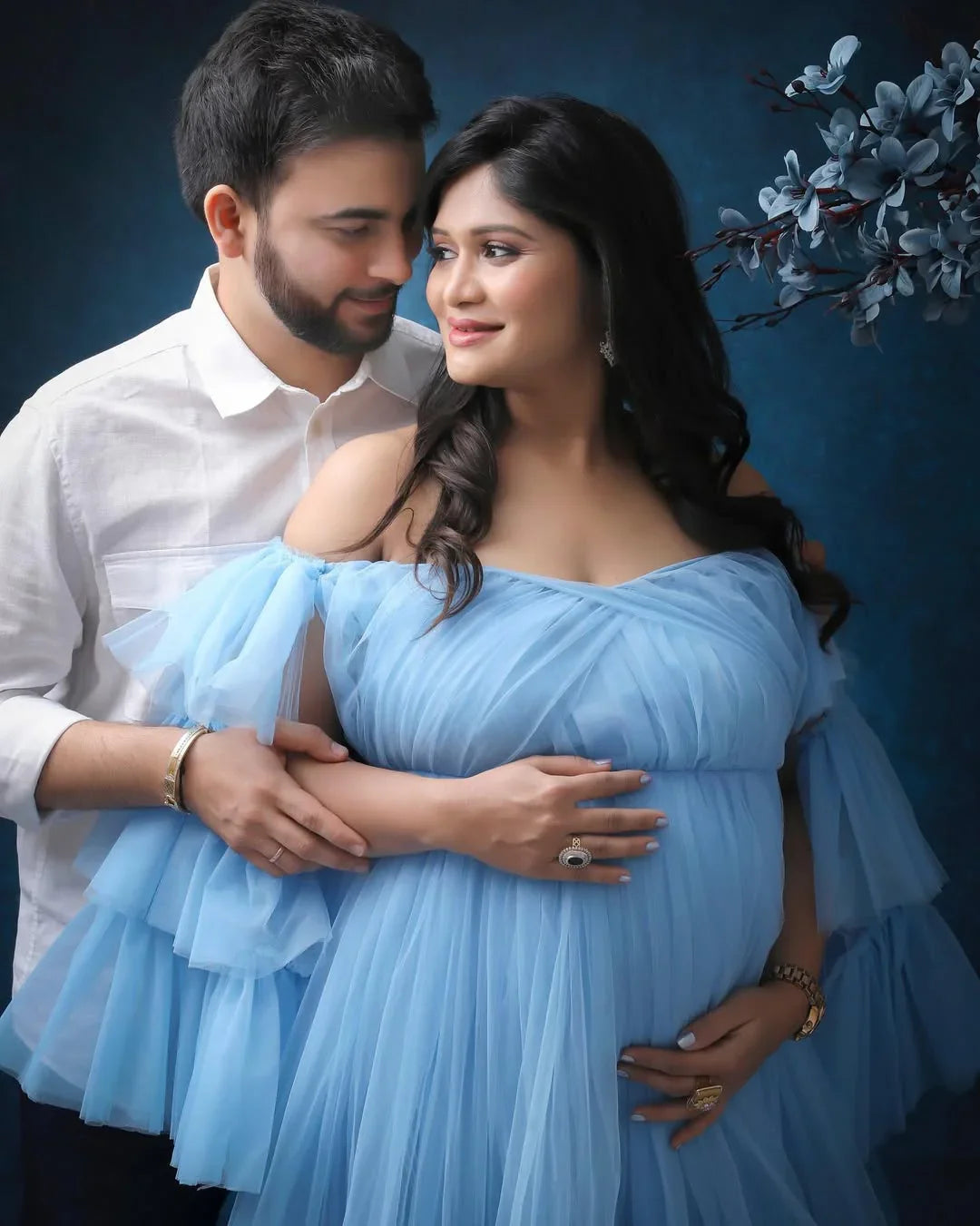 Keira Blue Maternity Gown by FlairNFrillz featuring flowing fabric and elegant design for expecting mothers.