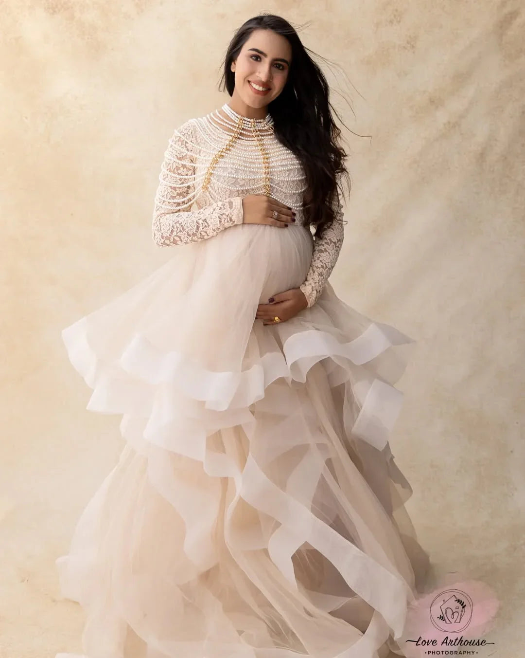 FlairNFrillz Rosa Gown maternity dress featuring a flowing, elegant design with soft fabric and floral accents in a serene pink hue.