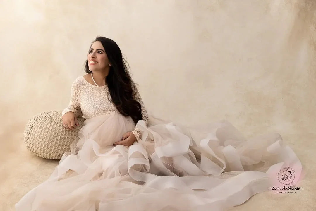 FlairNFrillz Rosa Maternity Gown with flowing fabric and elegant design, perfect for expecting mothers in a serene setting.