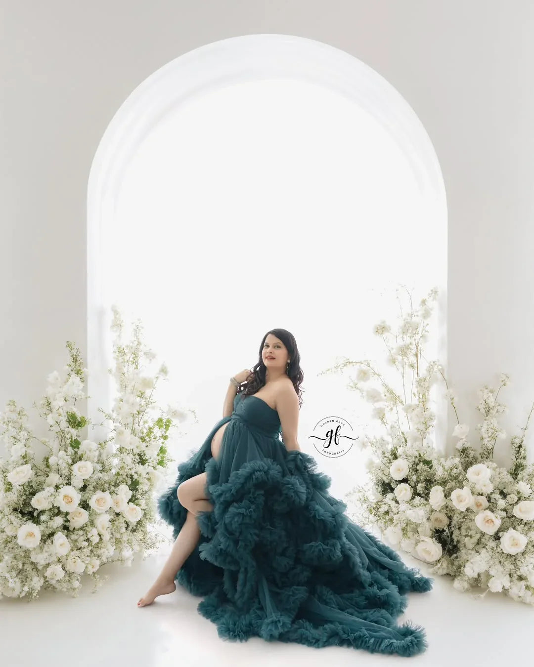 FlairNFrillz Saige Blue Maternity Dress displayed on a hanger, featuring a flowing fabric and elegant design for expecting mothers.