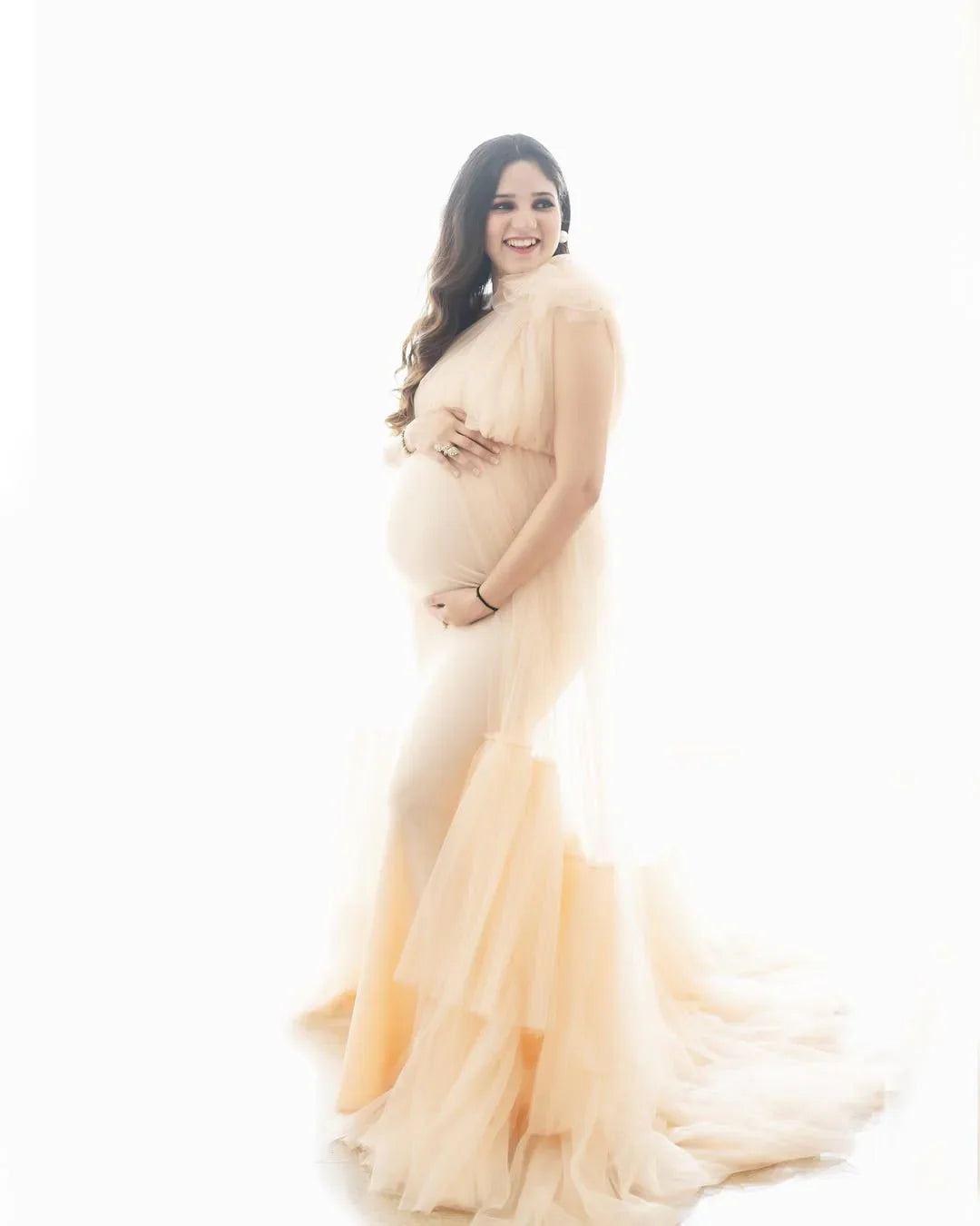 Angie beige maternity gown by FlairNFrillz, flowing fabric with elegant design, perfect for expecting mothers.