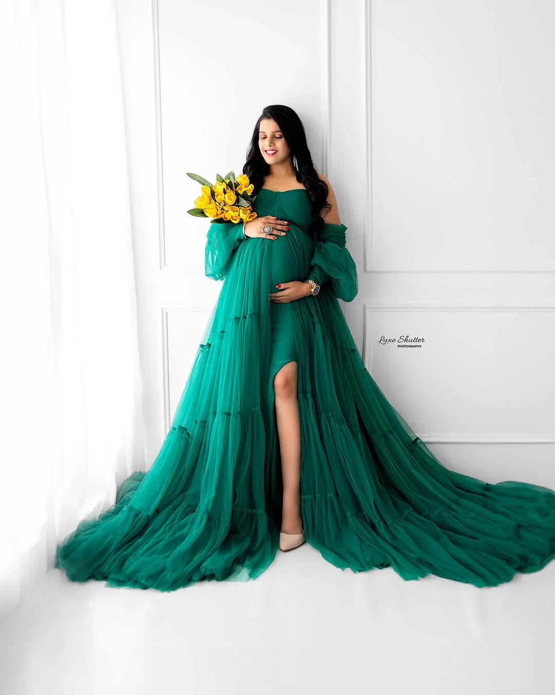 FlairNFrillz Sasha Green Maternity Gown with flowing fabric and elegant design, perfect for expecting mothers.