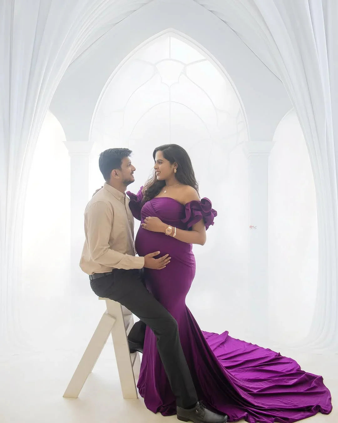 FlairNFrillz violet maternity gown with flowing fabric and elegant design, perfect for expecting mothers at special occasions.