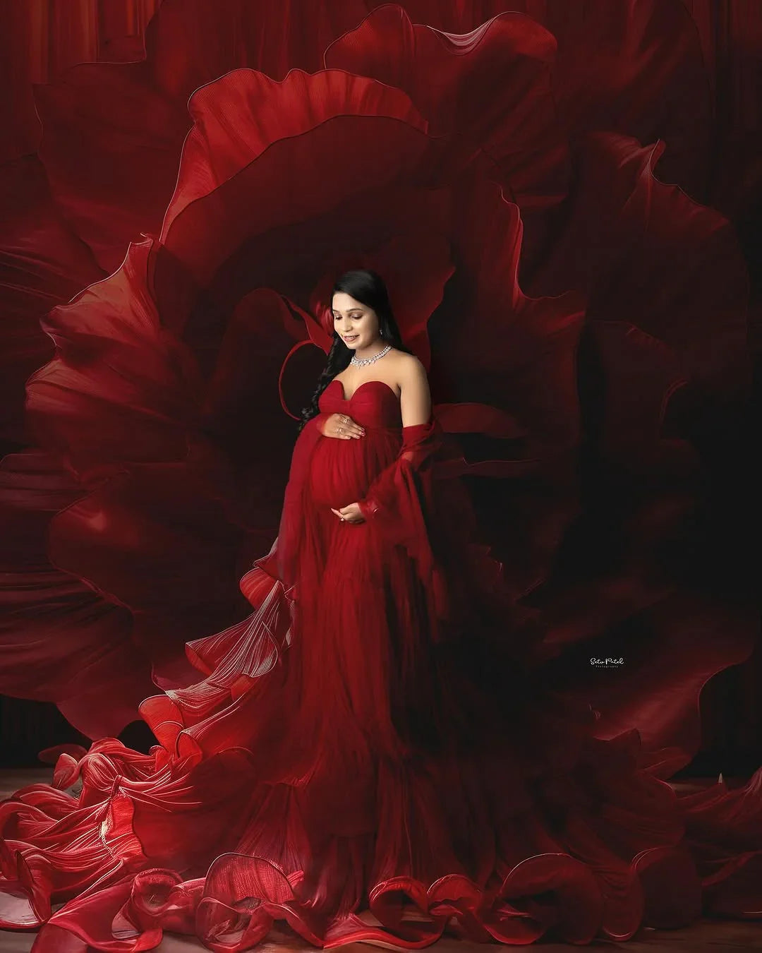 Nadia Maroon maternity gown by FlairNFrillz featuring a flowing fabric and elegant design for expecting mothers.