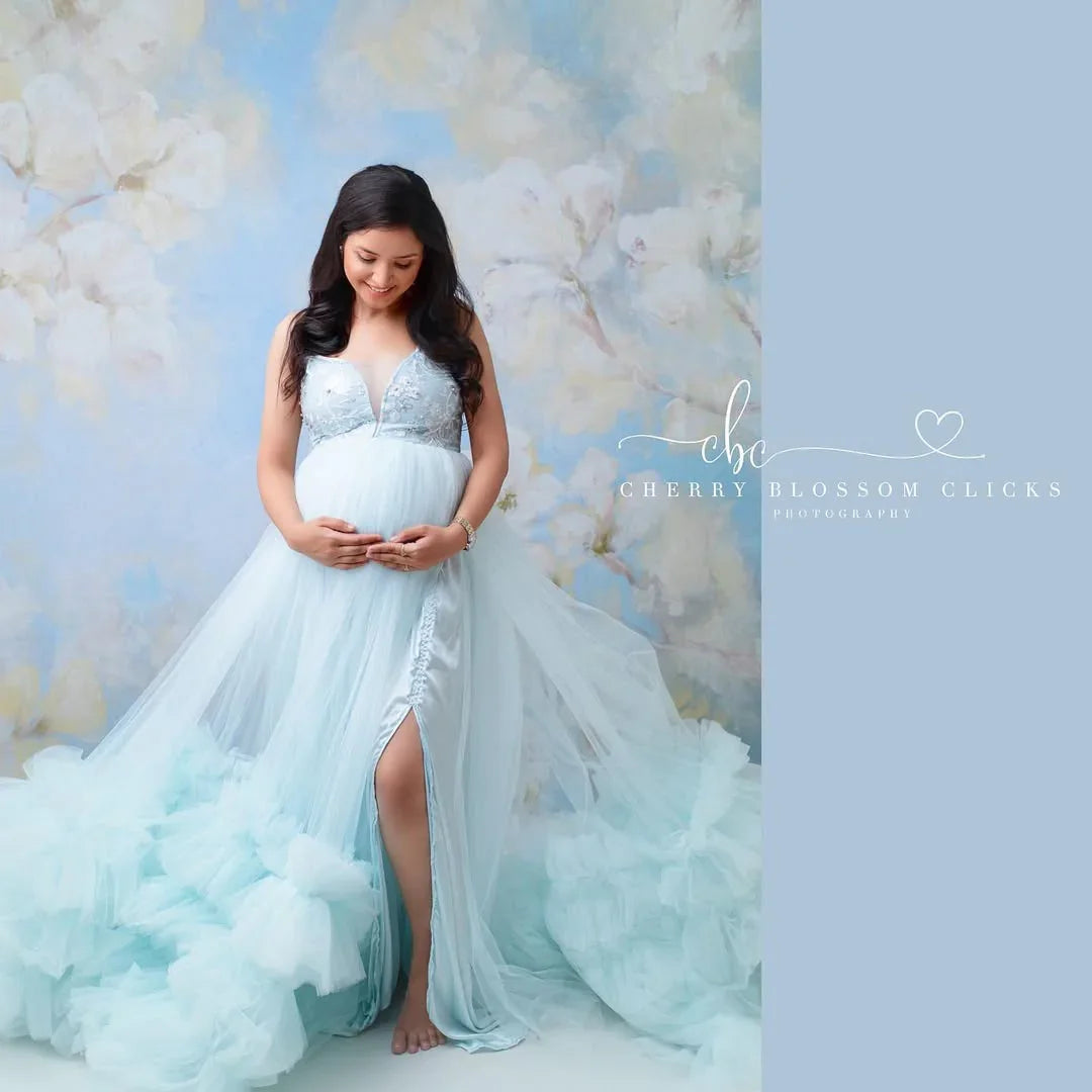 FlairNFrillz Alia Blue Maternity Dress displayed on a hanger, featuring a flowing fabric and elegant design for expecting mothers.