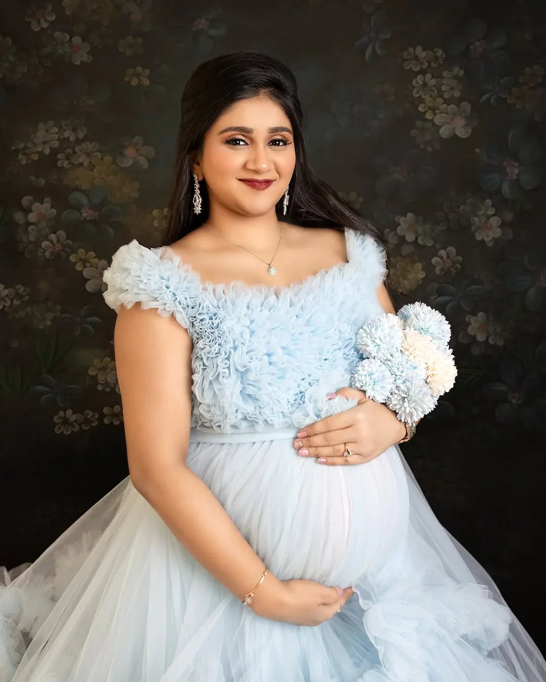 Blue Erin maternity gown by FlairNFrillz featuring flowing fabric and elegant design for comfortable maternity wear.