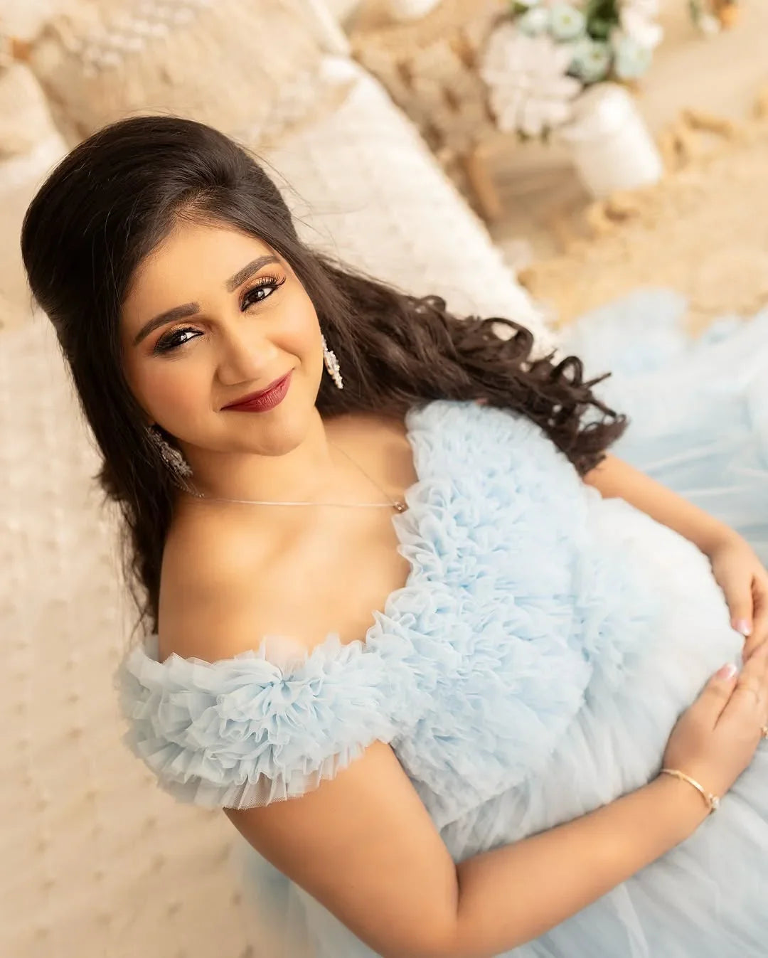 Blue Erin maternity gown by FlairNFrillz featuring a flowing fabric and elegant design, perfect for expecting mothers.
