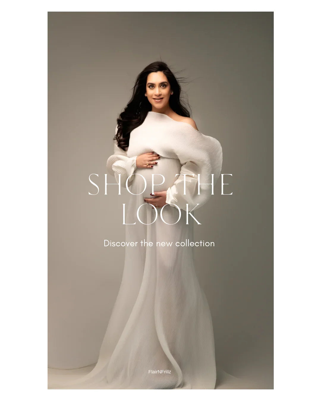 Pregnant woman in elegant white maternity gown posing in minimalist studio setting