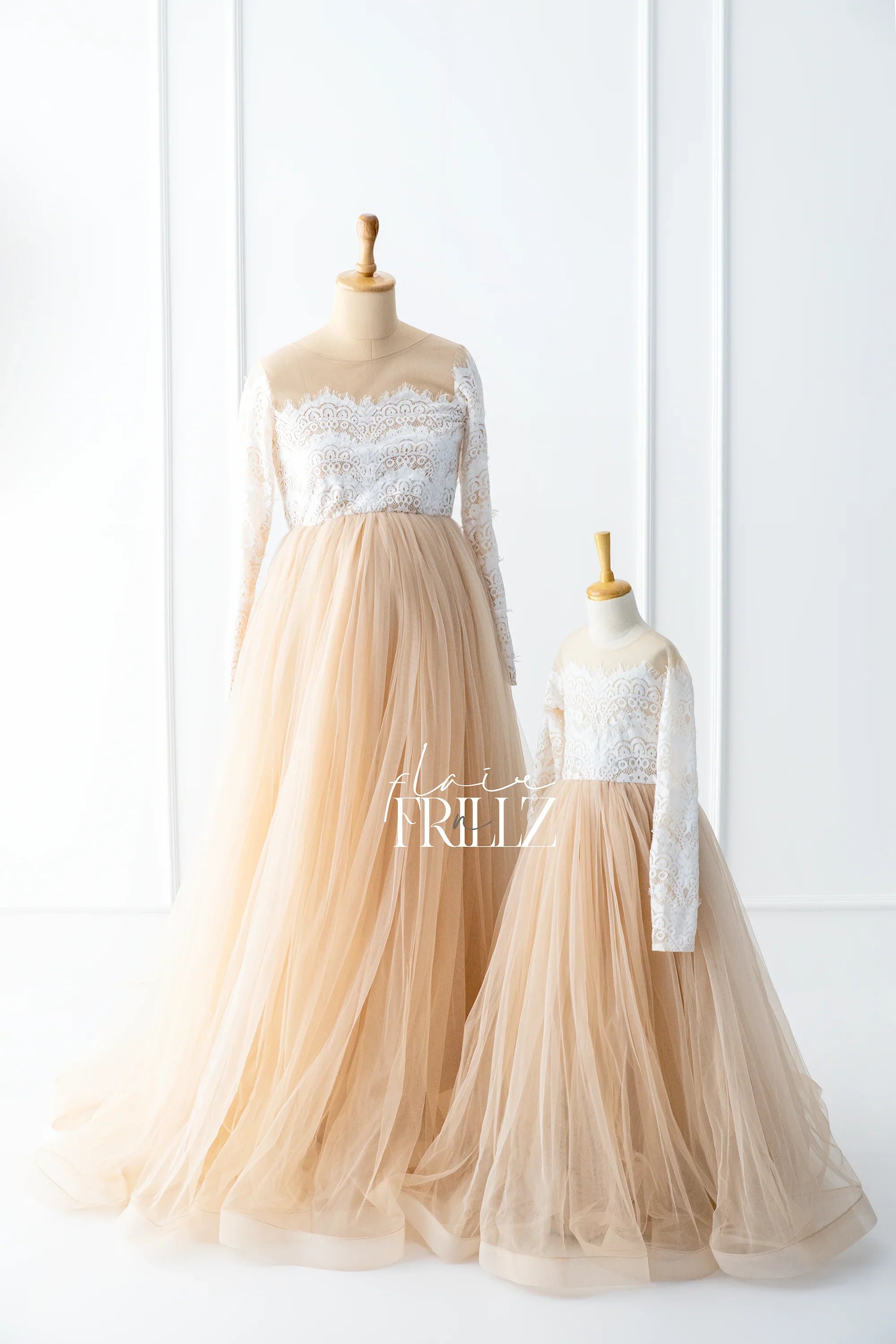 Matching maternity and child tulle gowns with white lace bodice and long sleeves