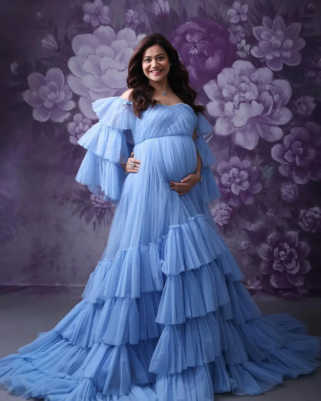 Keira Blue Maternity Gown by FlairNFrillz featuring flowing fabric and elegant design for expecting mothers.