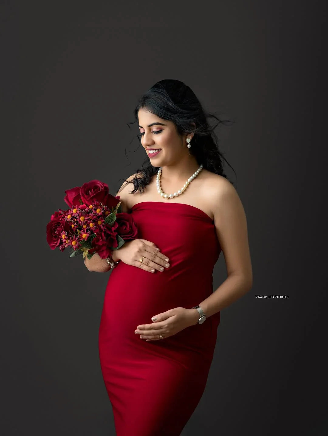 Johanna Maroon Maternity Gown by FlairNFrillz featuring flowing fabric and elegant design for expecting mothers.