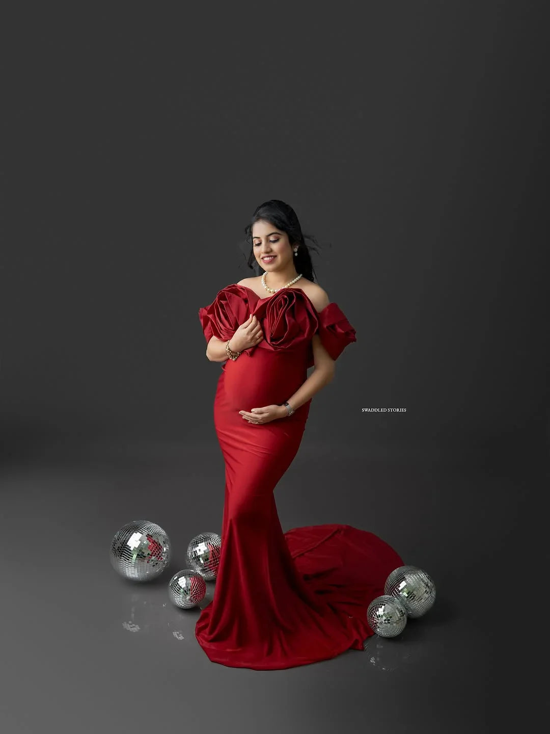 Johanna Maroon Maternity Gown by FlairNFrillz, featuring elegant fabric and flowing design for expecting mothers.