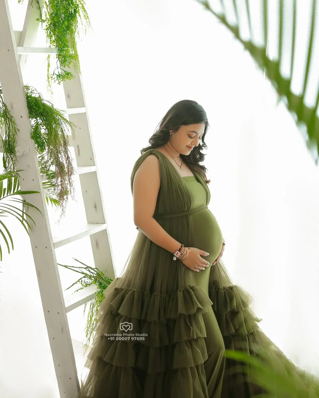 FlairNFrillz Delilah Olive Maternity Robe Gown displayed on a model, featuring soft fabric and elegant design for expectant mothers.