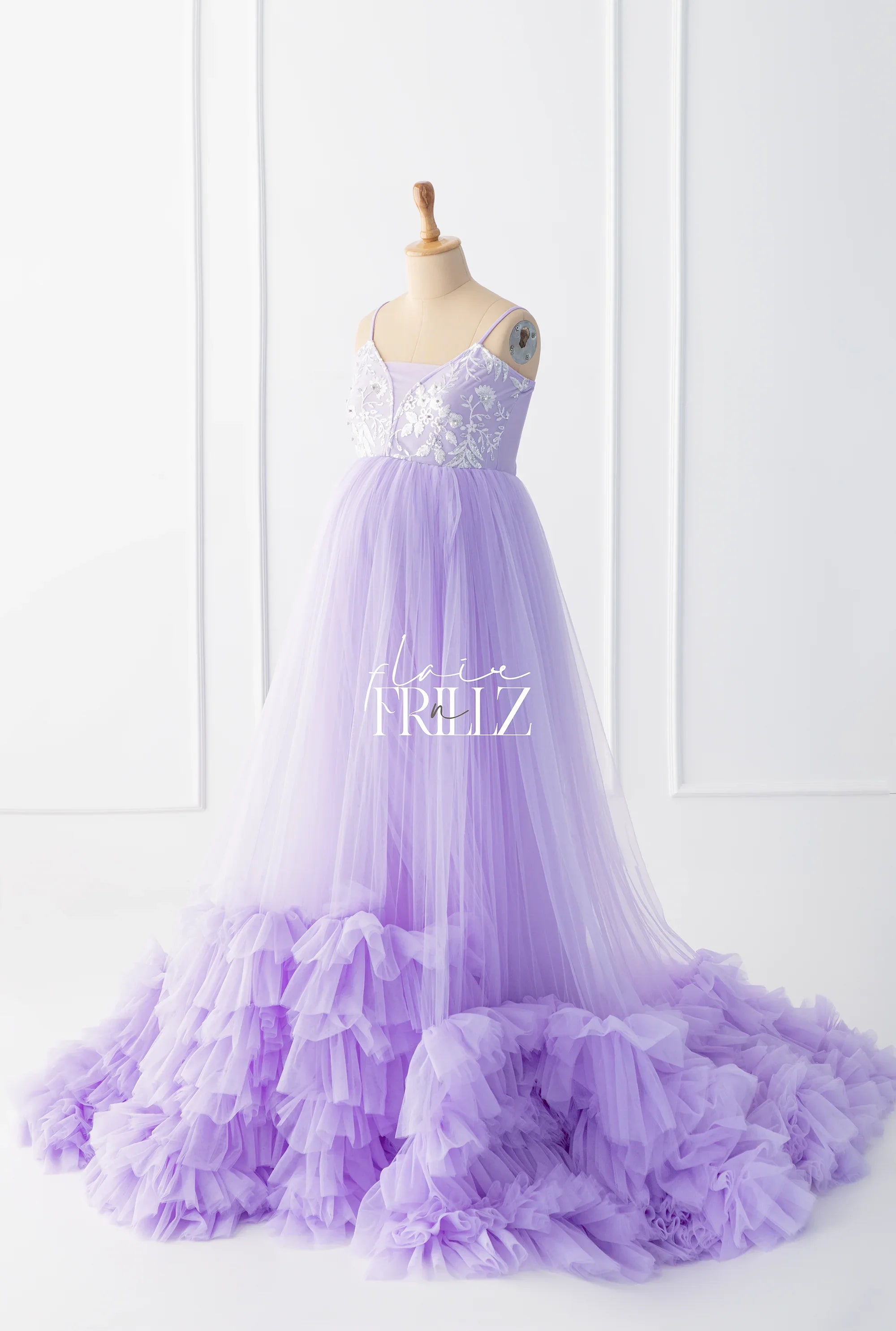 Lavender maternity gown with tulle ruffles and sequin floral bodice on mannequin