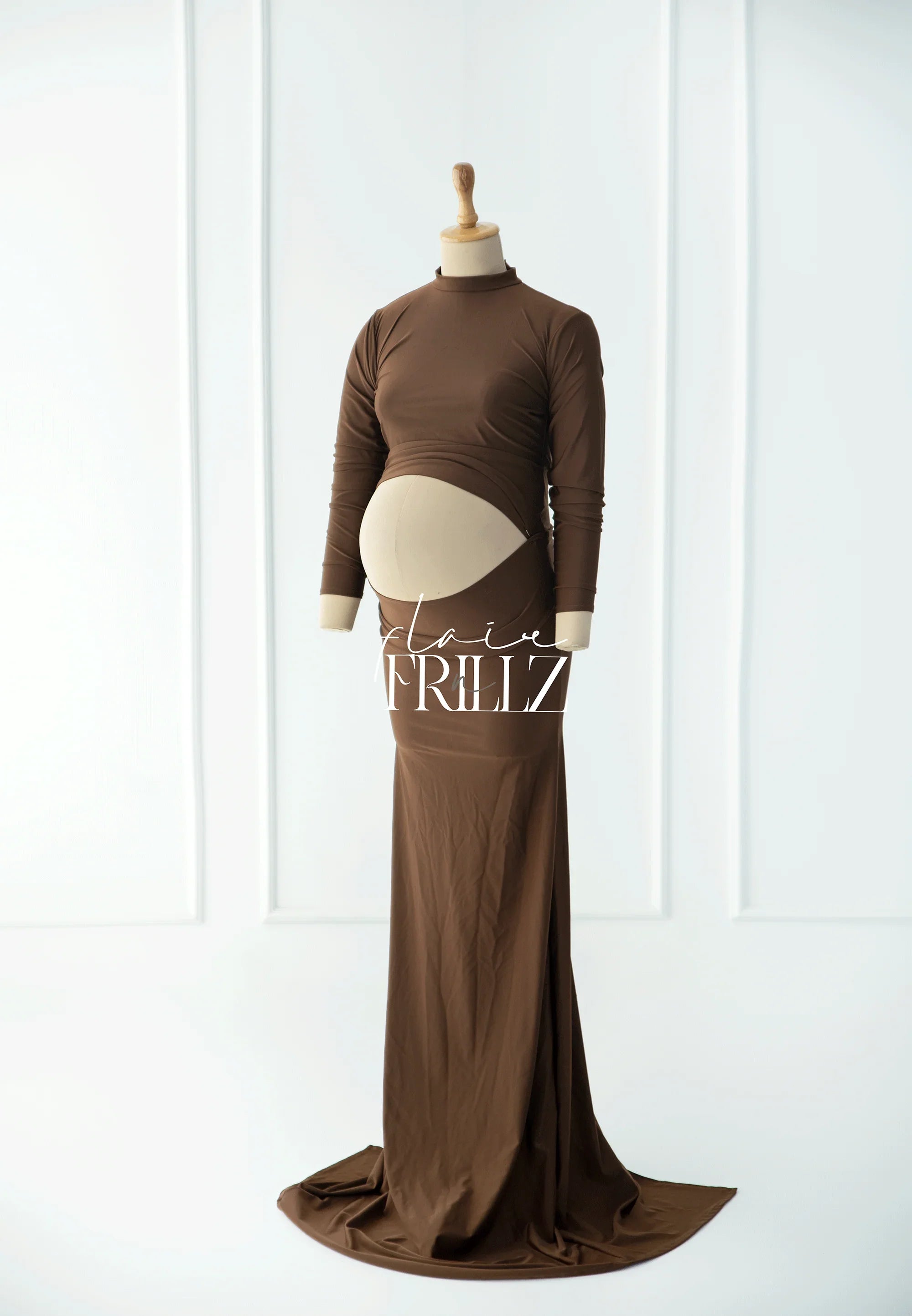 Brown long sleeve maternity gown with belly cutout on a mannequin in a studio setting