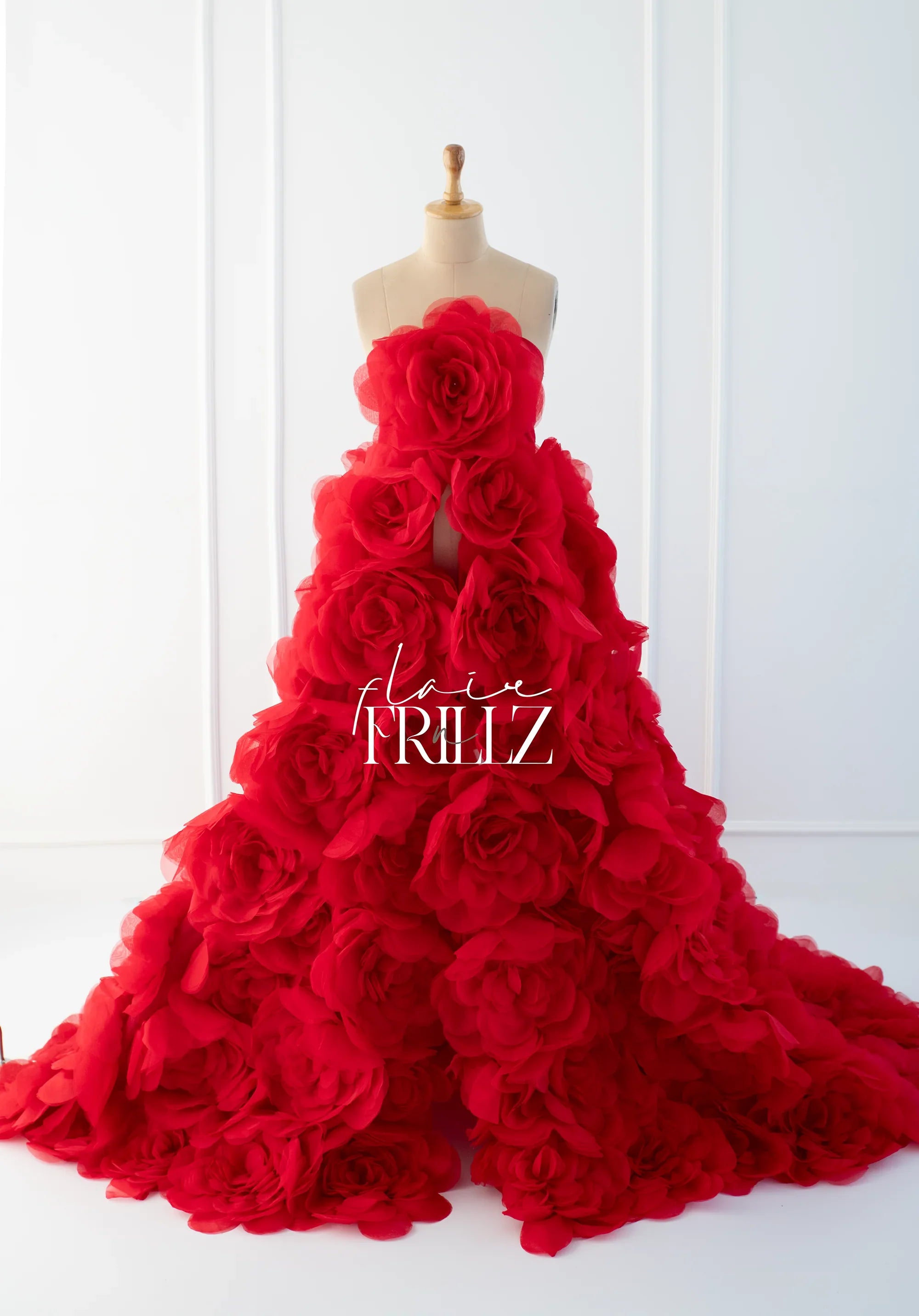 FlairaRed Floral Gown maternity dress with flowing fabric and vibrant red floral pattern, designed for expecting mothers.