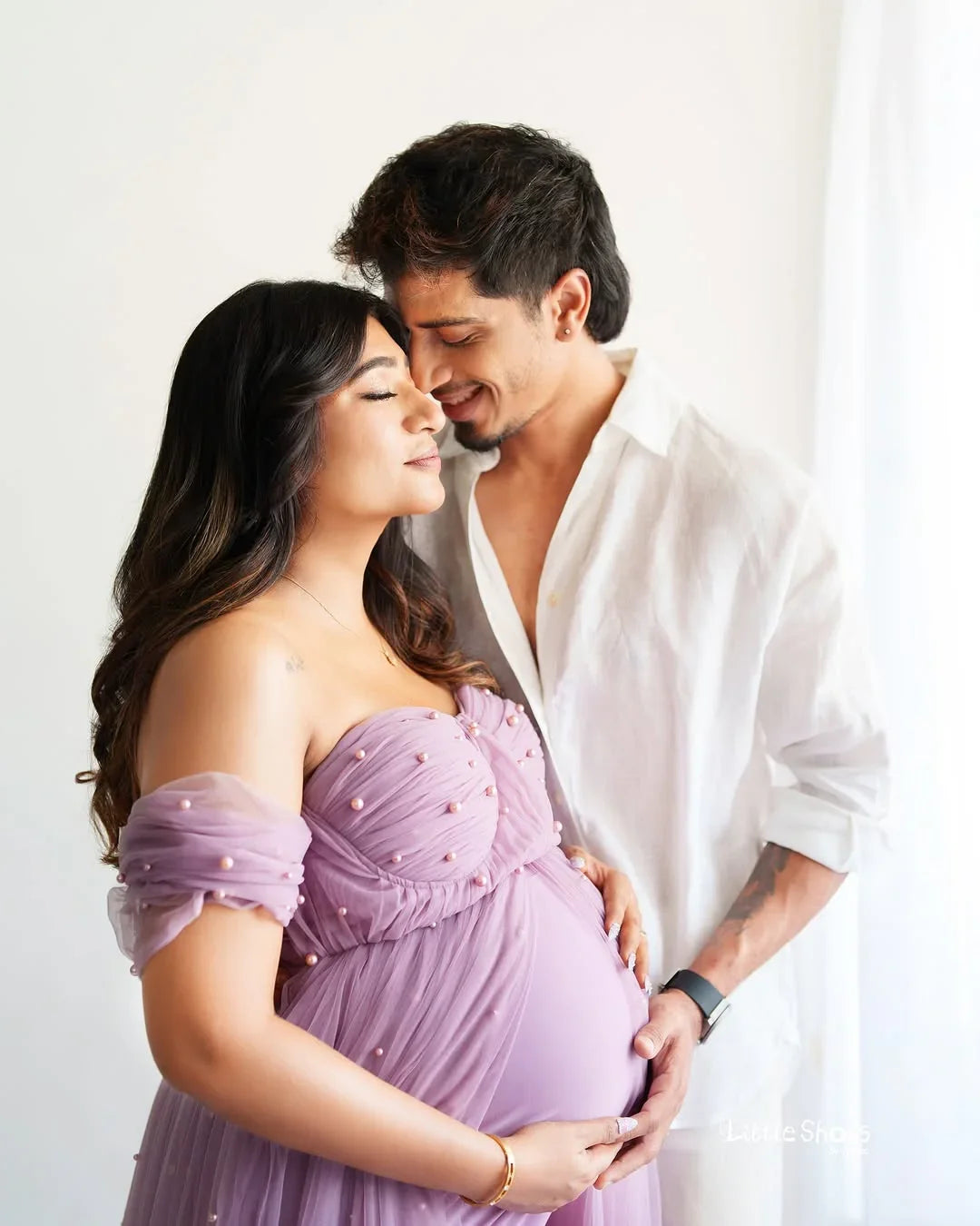Sophia Mauve Pearl Maternity Gown by FlairNFrillz featuring elegant mauve fabric and pearl embellishments, perfect for expecting mothers.