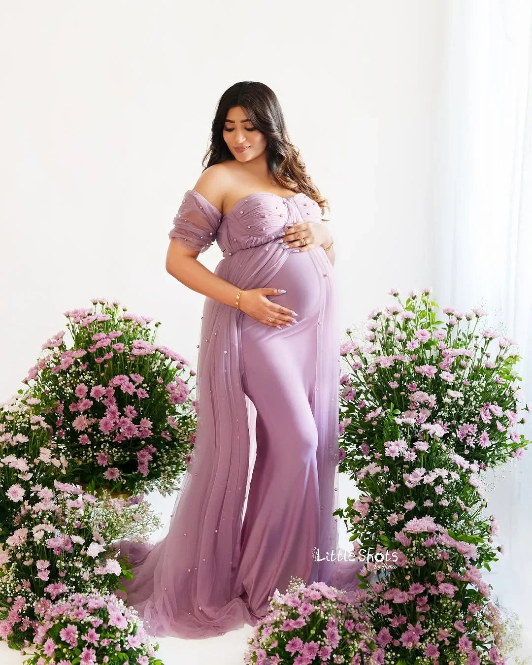 Maternity dress by FlairNFrillz: Sophia Mauve Pearl Gown with elegant fabric and floral details, suitable for special occasions.