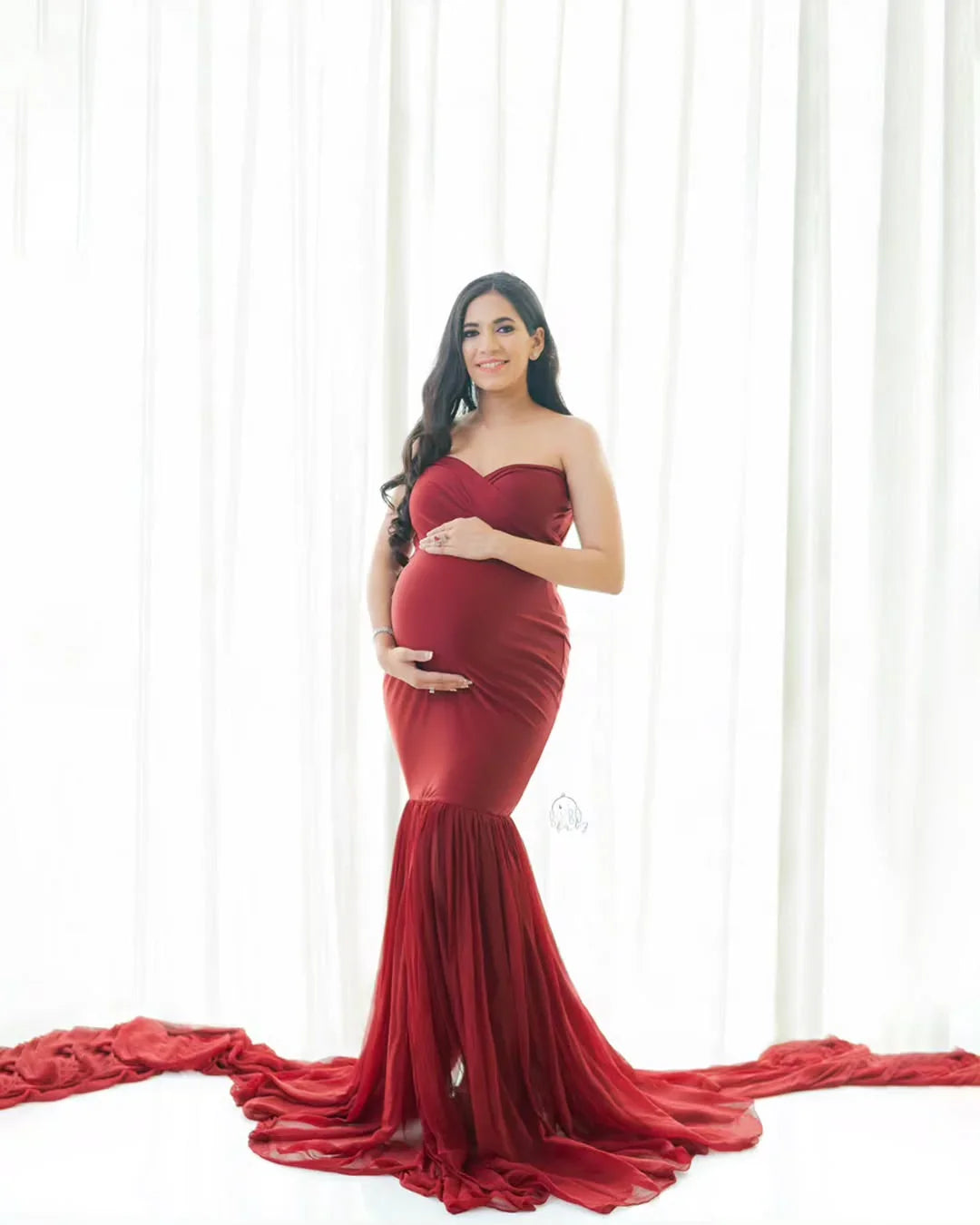 Red Eleanor maternity gown by FlairNFrillz, flowing fabric and elegant design, perfect for expecting mothers.