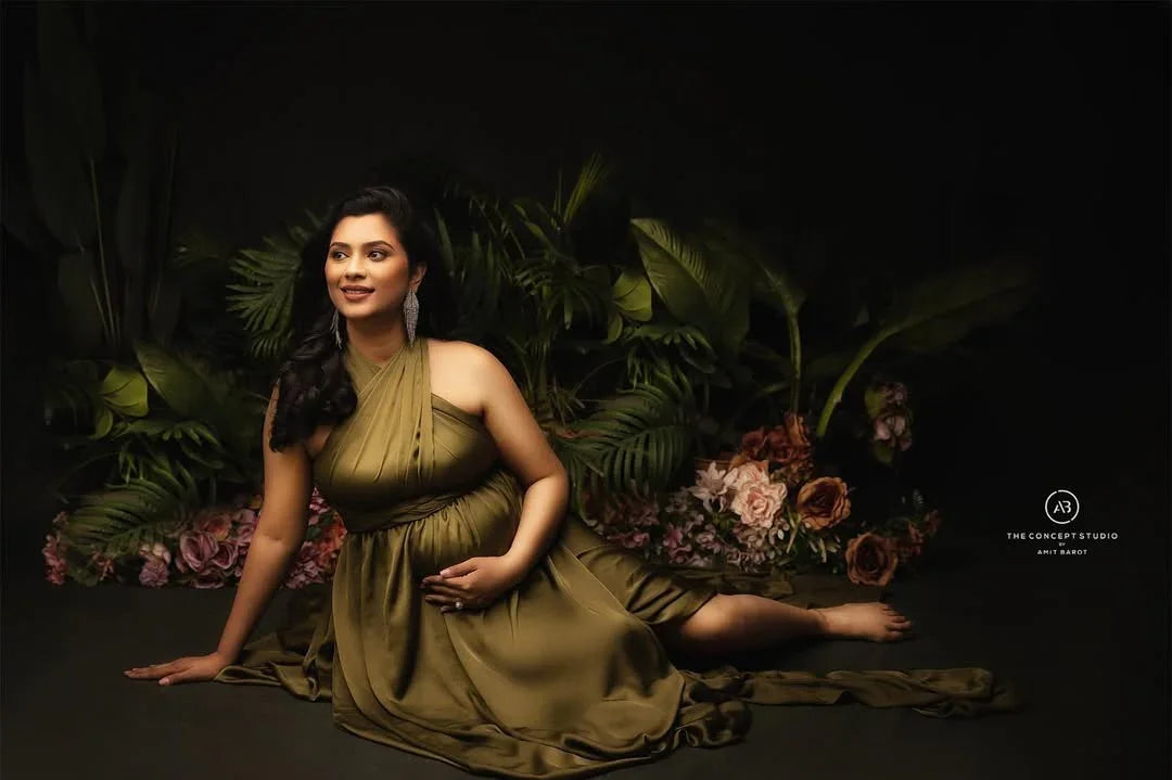 Evie Green Maternity Gown by FlairNFrillz featuring flowing fabric and elegant design for comfortable maternity wear.