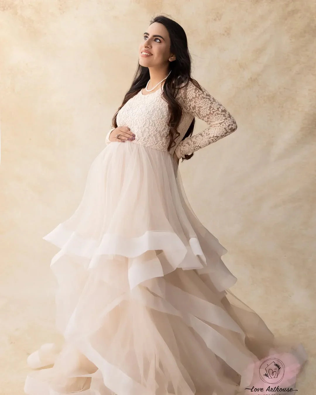 FlairNFrillz Rosa Maternity Dress showing a flowing pink gown with elegant design and comfortable fit for expecting mothers.