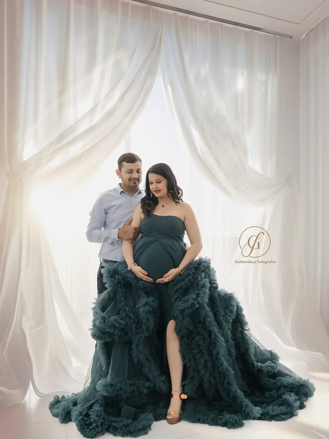 FlairNFrillz Saige Blue Maternity Dress displayed on a hanger with flowing fabric and elegant design, perfect for expecting mothers.