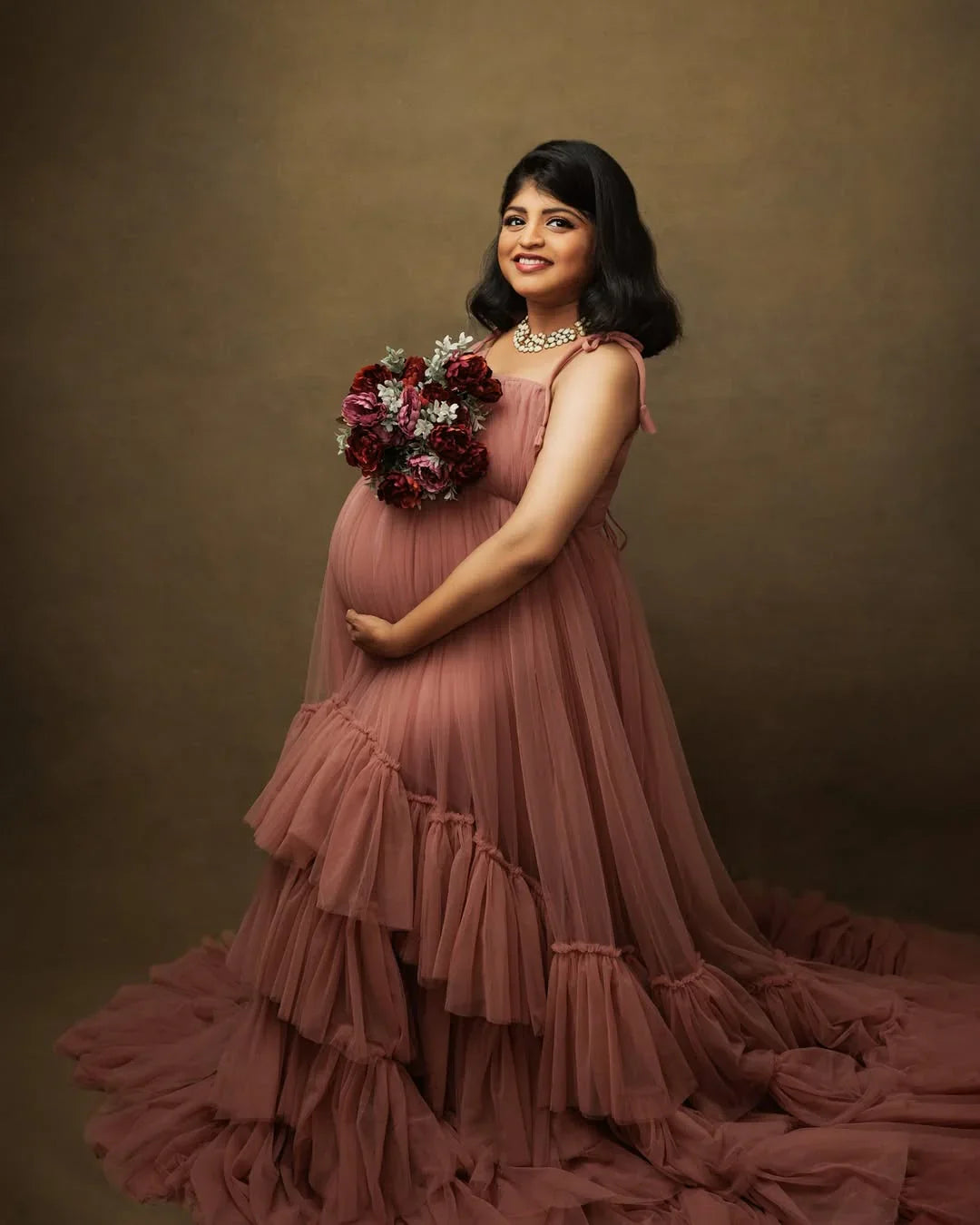 Mauve maternity gown by FlairNFrillz featuring a flowing design, perfect for expecting mothers, shown on a model.