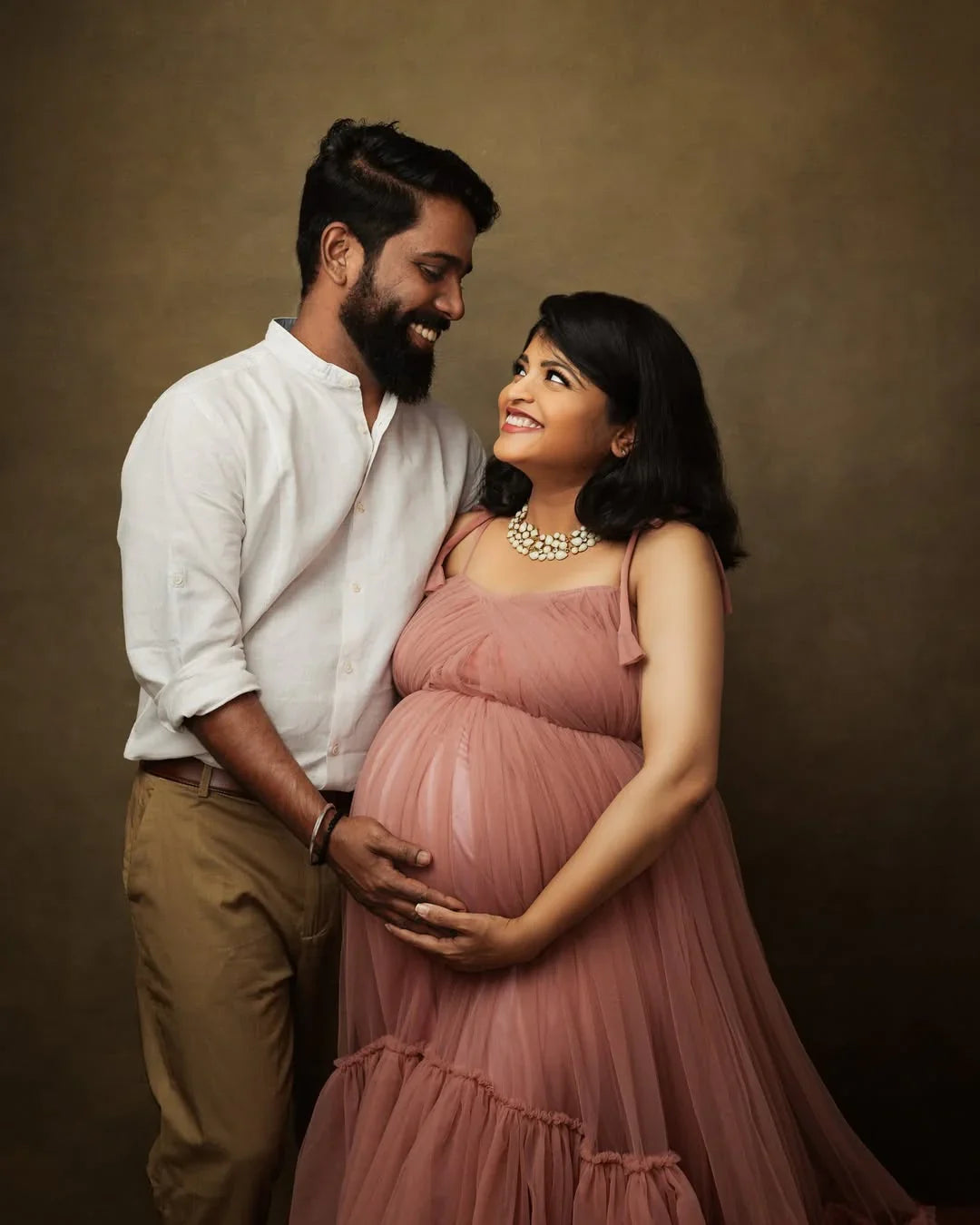 Mauve maternity gown by FlairNFrillz, featuring flowing fabric and elegant design, ideal for expectant mothers.