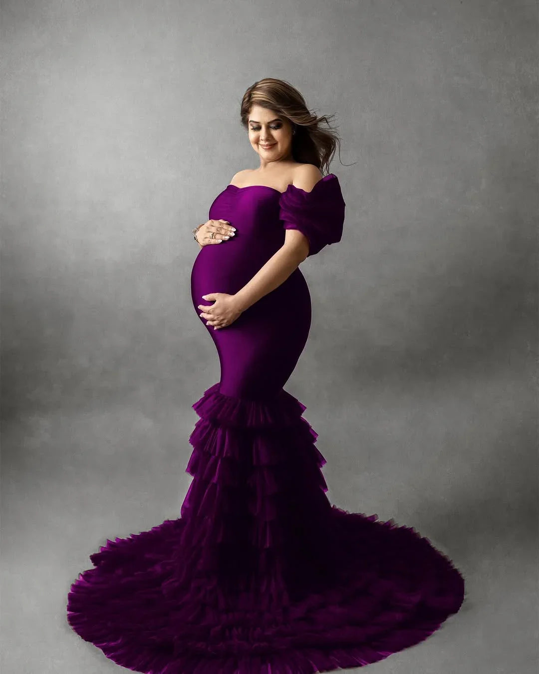 FlairNFrillz Ember Wine Maternity Dress displayed on a model, featuring a flowing design suitable for special occasions.