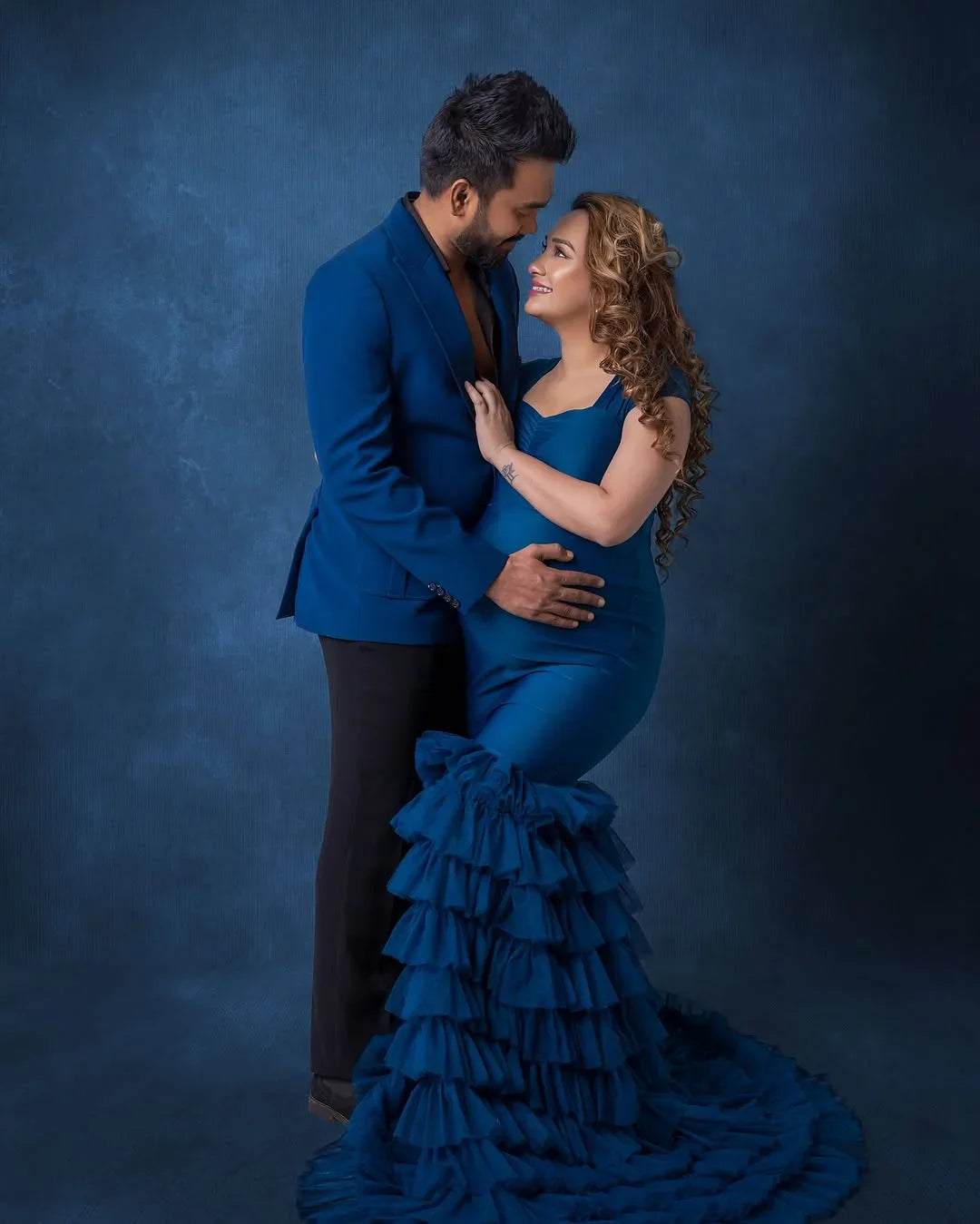 Ember teal maternity dress by FlairNFrillz featuring a flowing design, perfect for expecting mothers, shown on a model.