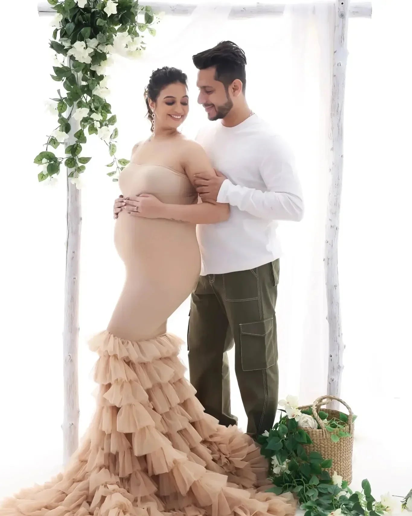 Ember Nude Maternity Dress by FlairNFrillz featuring a flowing fabric and elegant design for expecting mothers.
