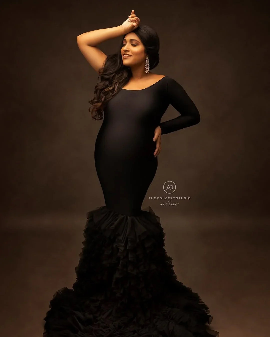 Rumi Black Maternity Gown by FlairNFrillz, flowing maternity dress with elegant design and comfortable fit, shown on a model.