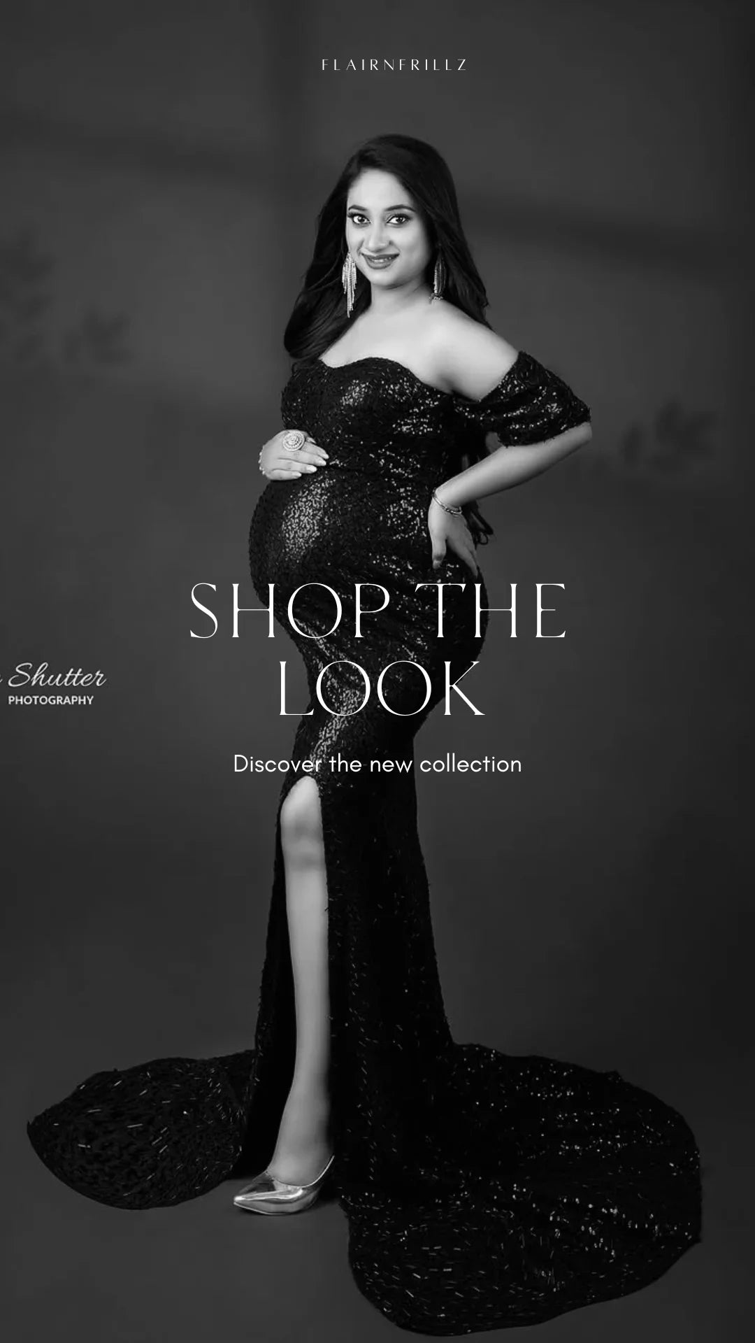 Pregnant woman in black sequin maternity gown with slit, posing in elegant studio setting