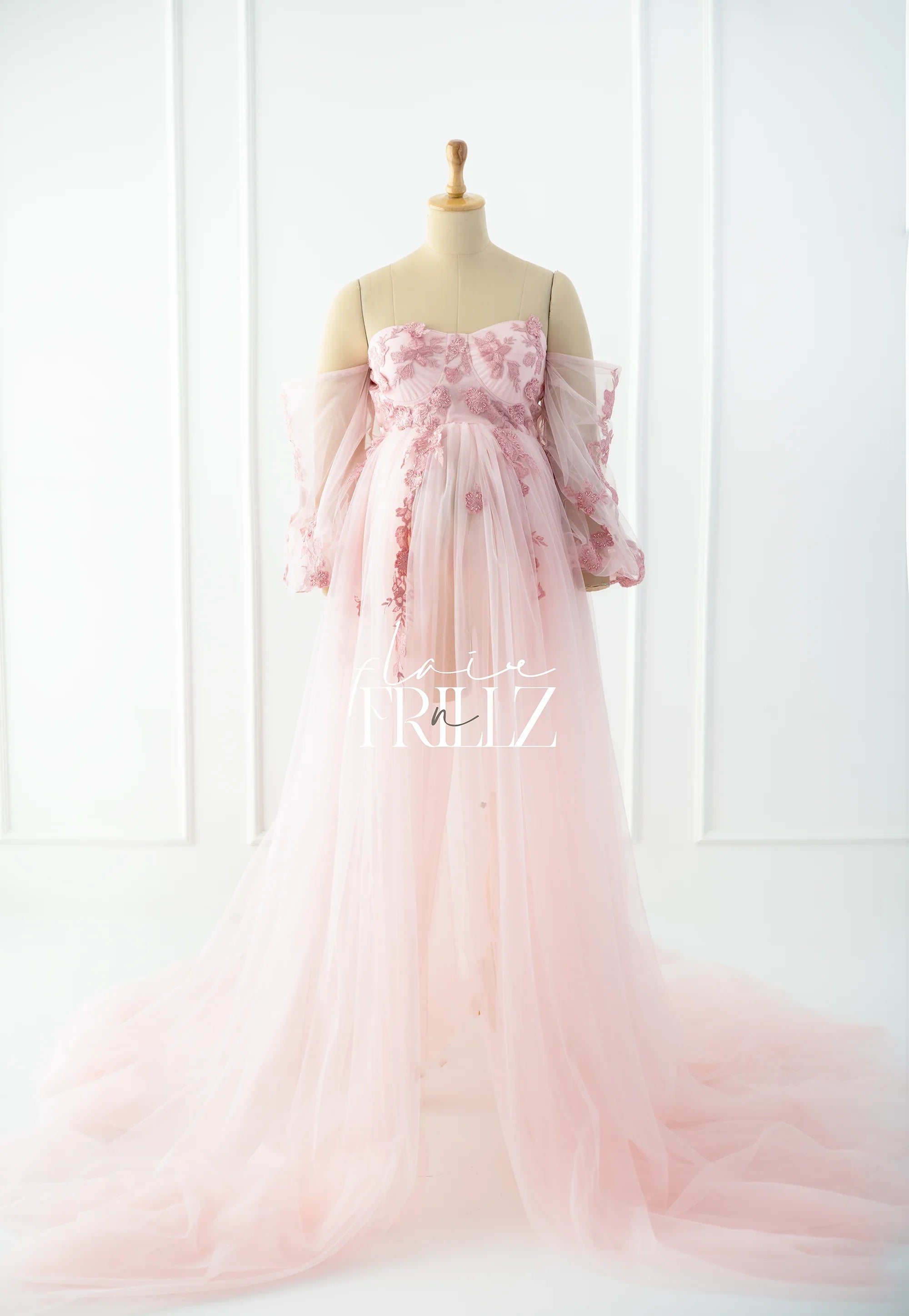 Pink floral embroidered maternity gown with off-shoulder tulle sleeves and a long train