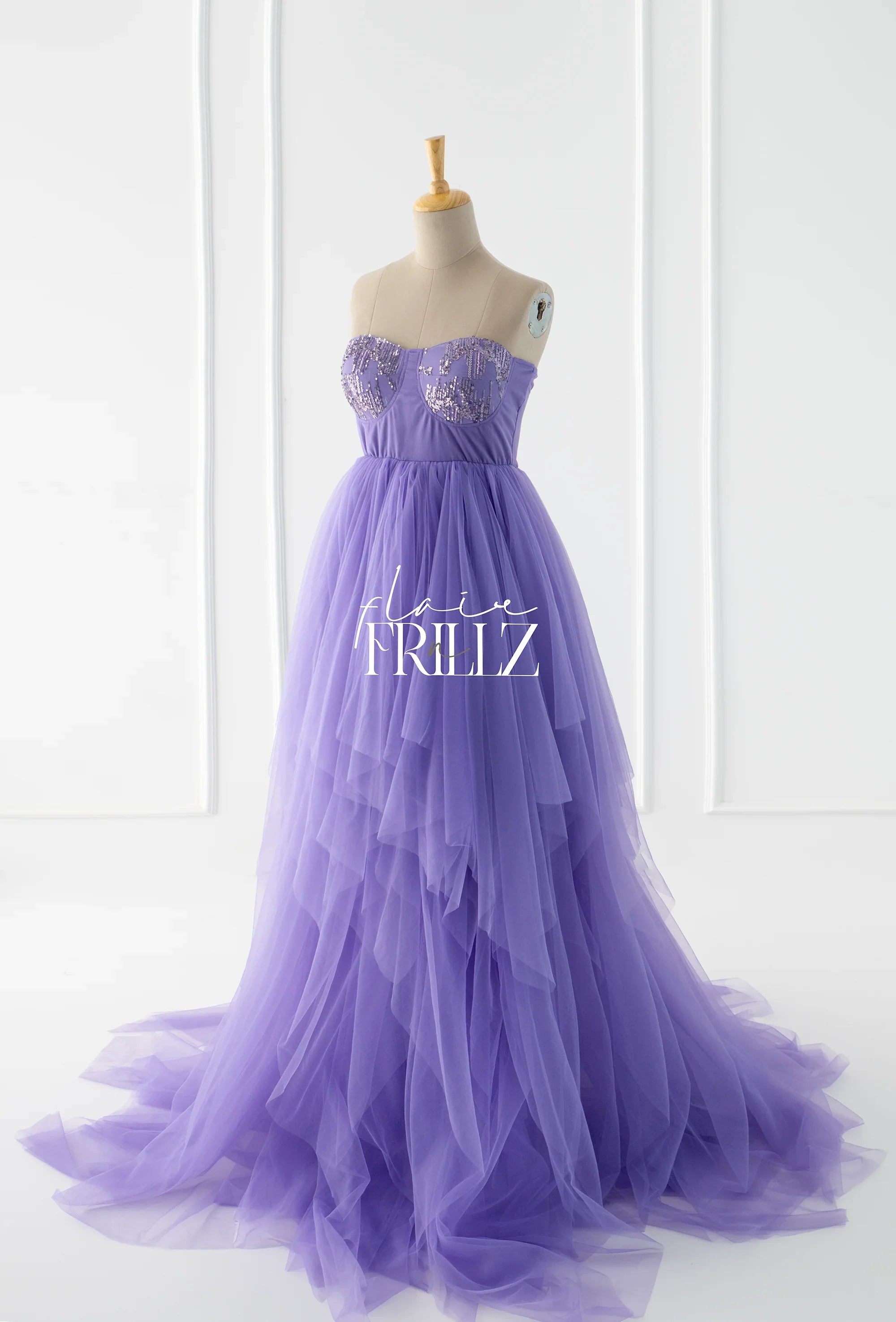 Lavender tulle maternity gown with sequin bodice on mannequin, elegant layered skirt