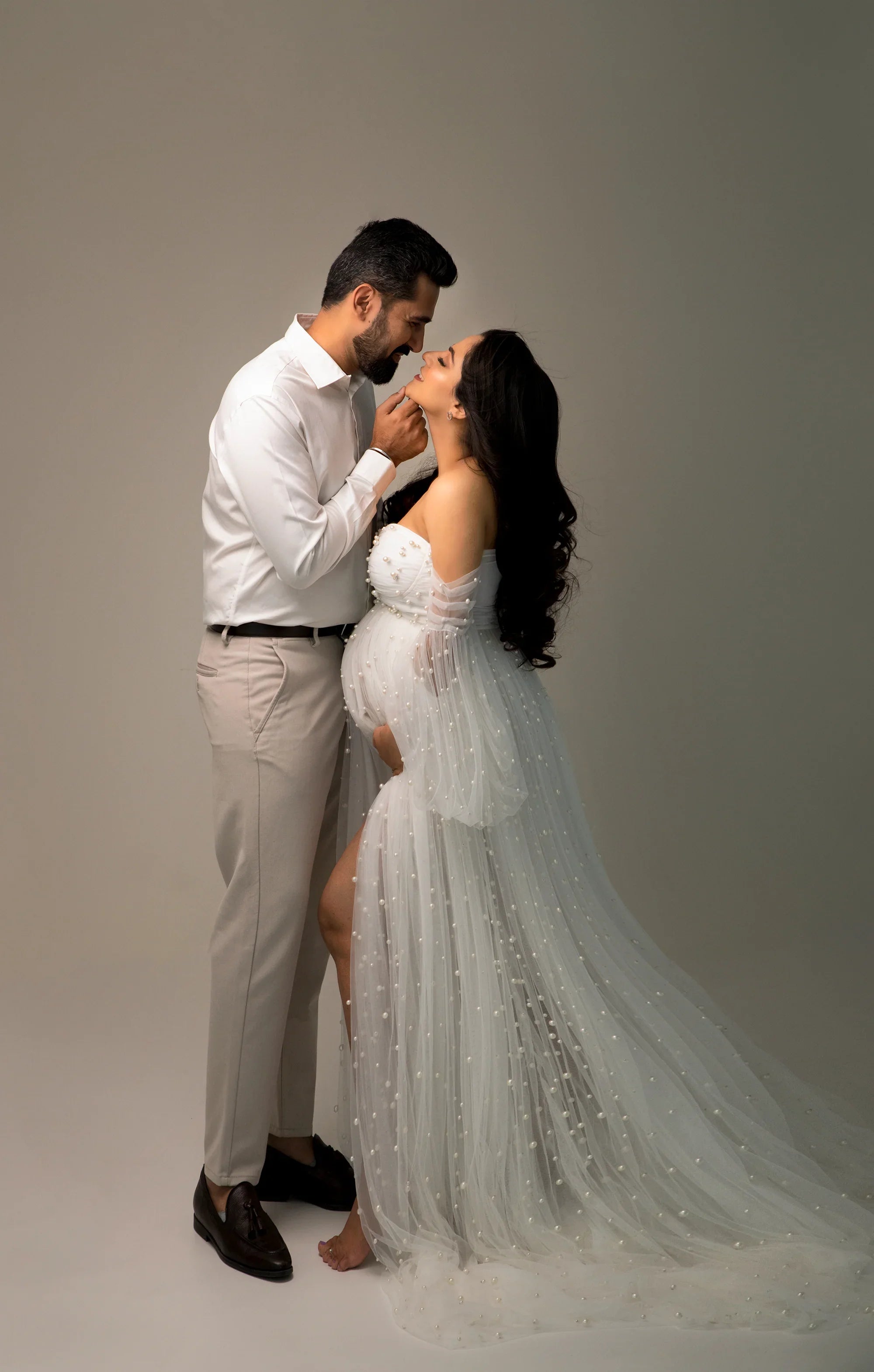 FlairNFrillz Sophie White Pearl Maternity Dress featuring elegant fabric and a flowing design, perfect for expecting mothers.