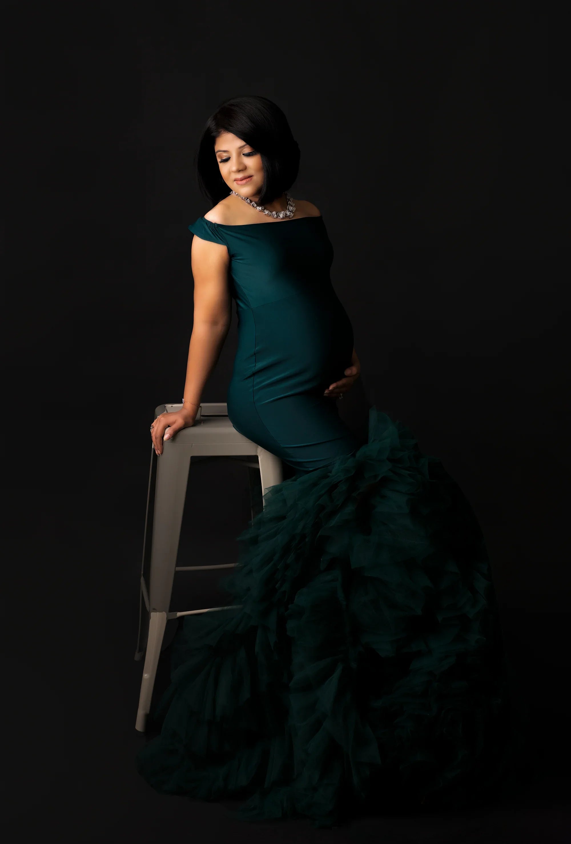 Green Inaya maternity gown by FlairNFrillz, flowing fabric with elegant design, perfect for expecting mothers.