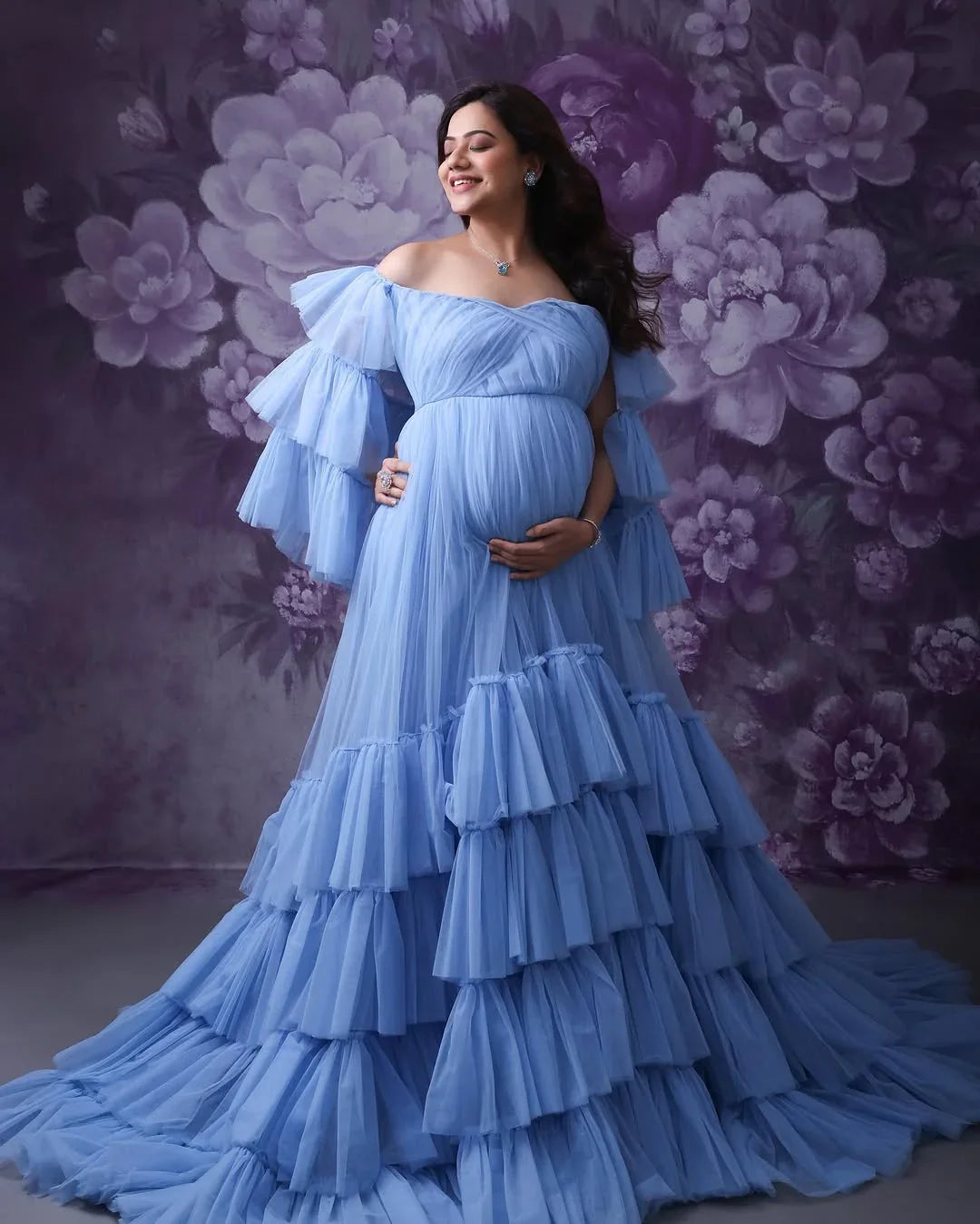 Keira Blue Maternity Gown by FlairNFrillz featuring flowing fabric and elegant design for expecting mothers.