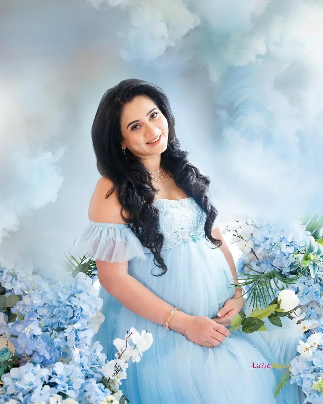 FlairNFrillz Kaya Blue Sequin Maternity Dress featuring a flowing design and elegant sequin details for special occasions.
