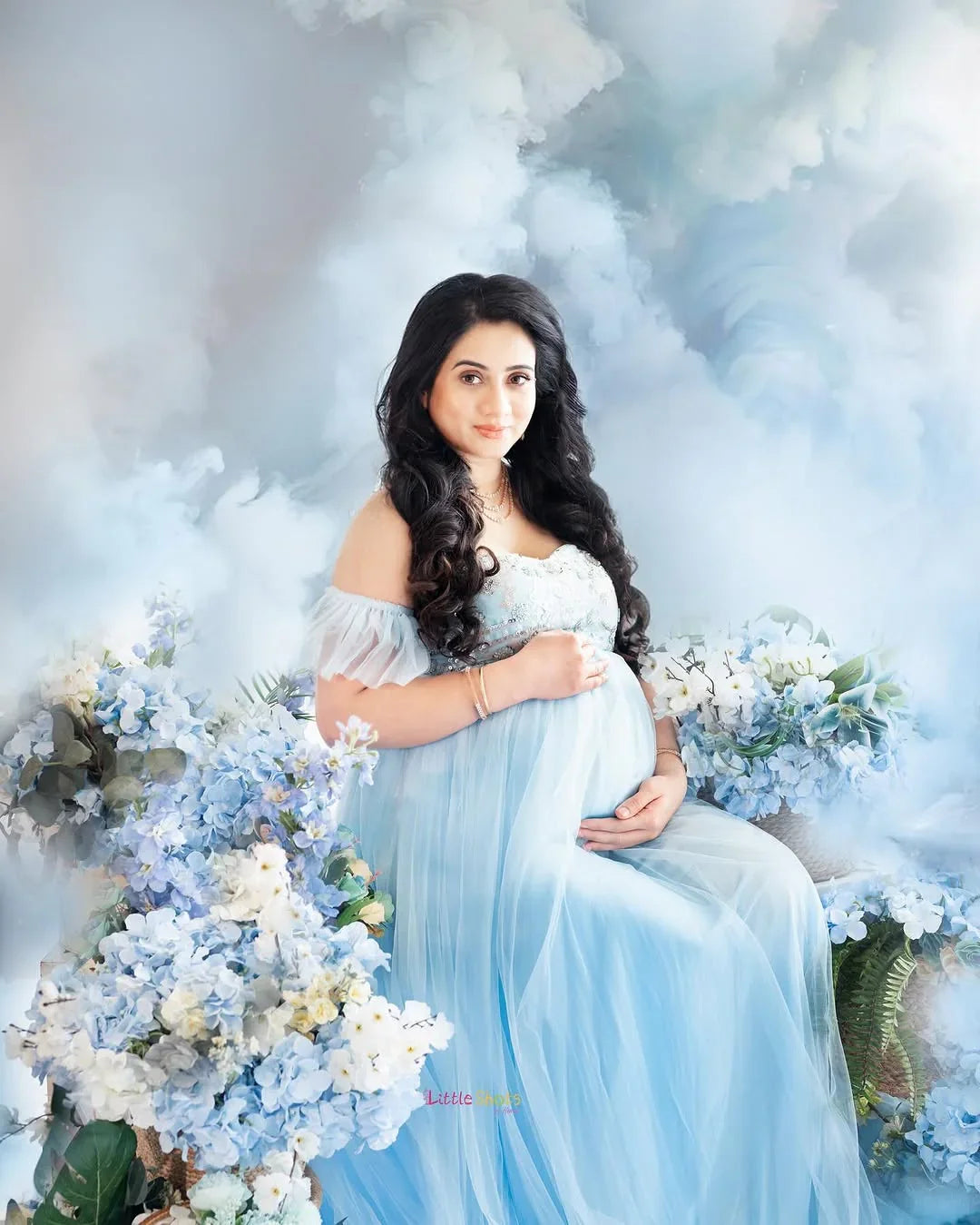 FlairNFrillz Kaya Blue Sequin Maternity Dress featuring elegant sequined fabric and a flowing design for special occasions.